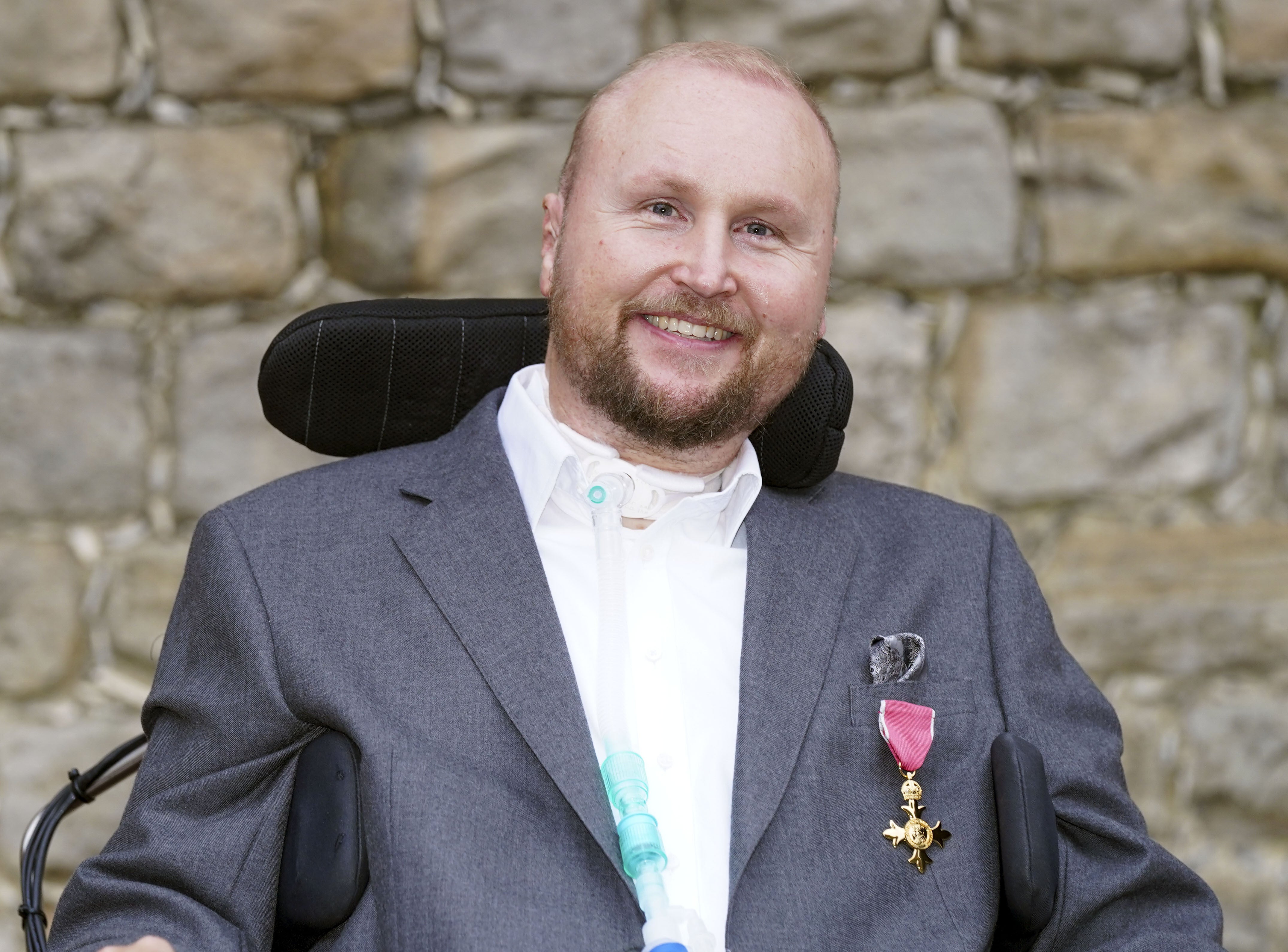 Matthew Hampson with his OBE following an investiture ceremony at Windsor Castle (Steve Parsons/PA)