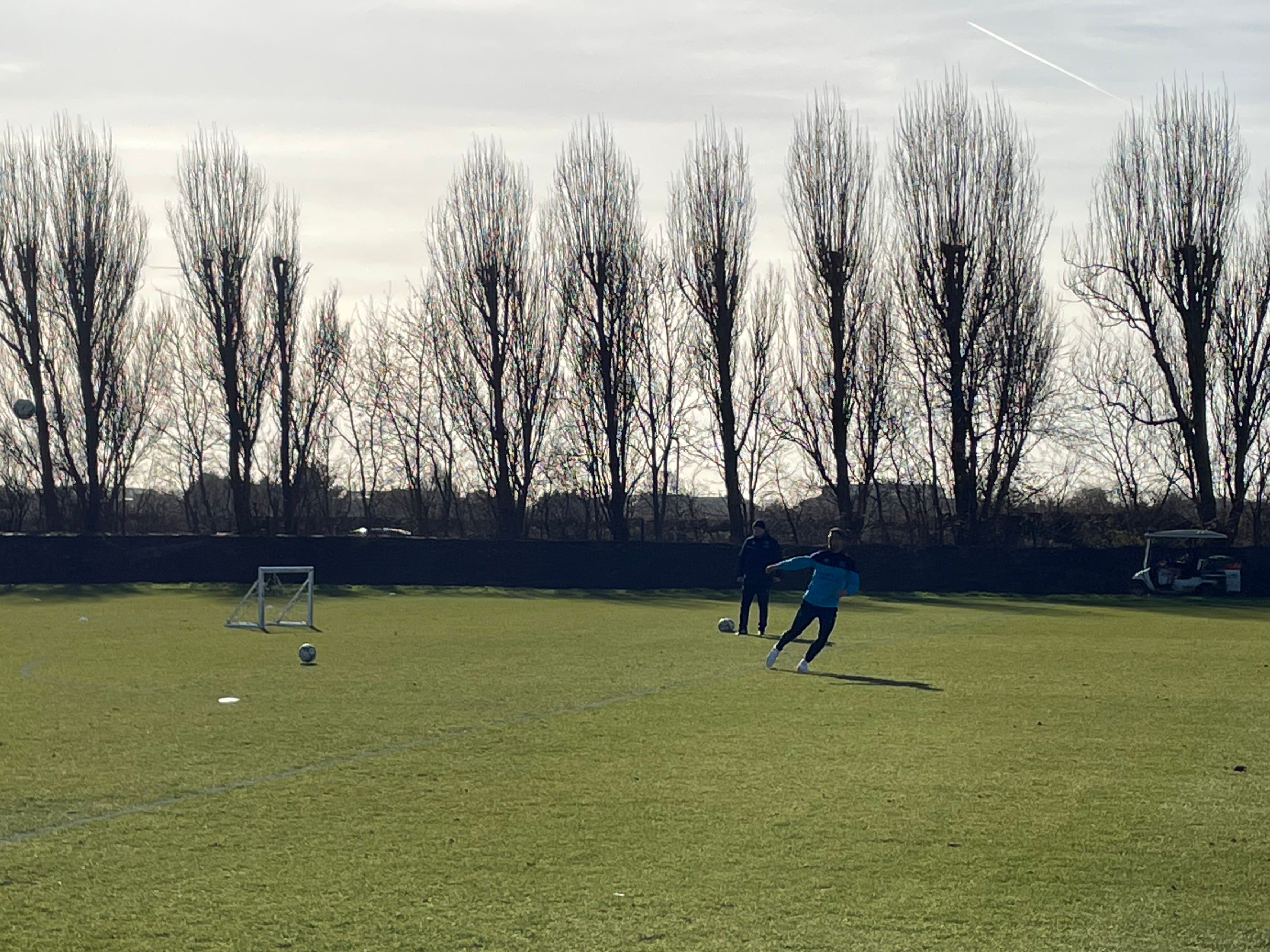 Neil Banfield works with Dominic Ball on cross-field passes as training finishes