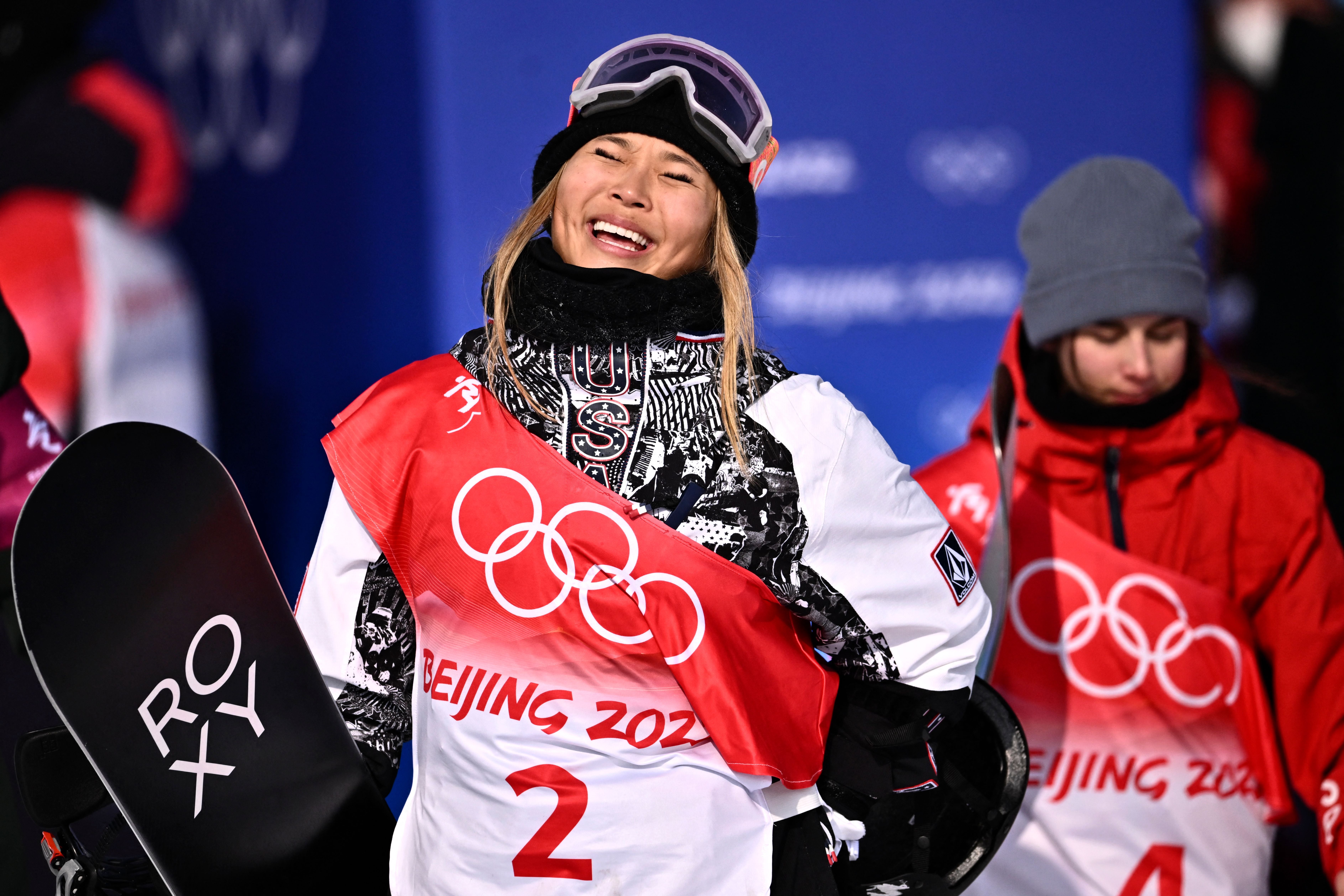 USA's Chloe Kim celebrates as she wins the snowboard women's halfpipe final run during the Beijing 2022 Winter Olympic Games