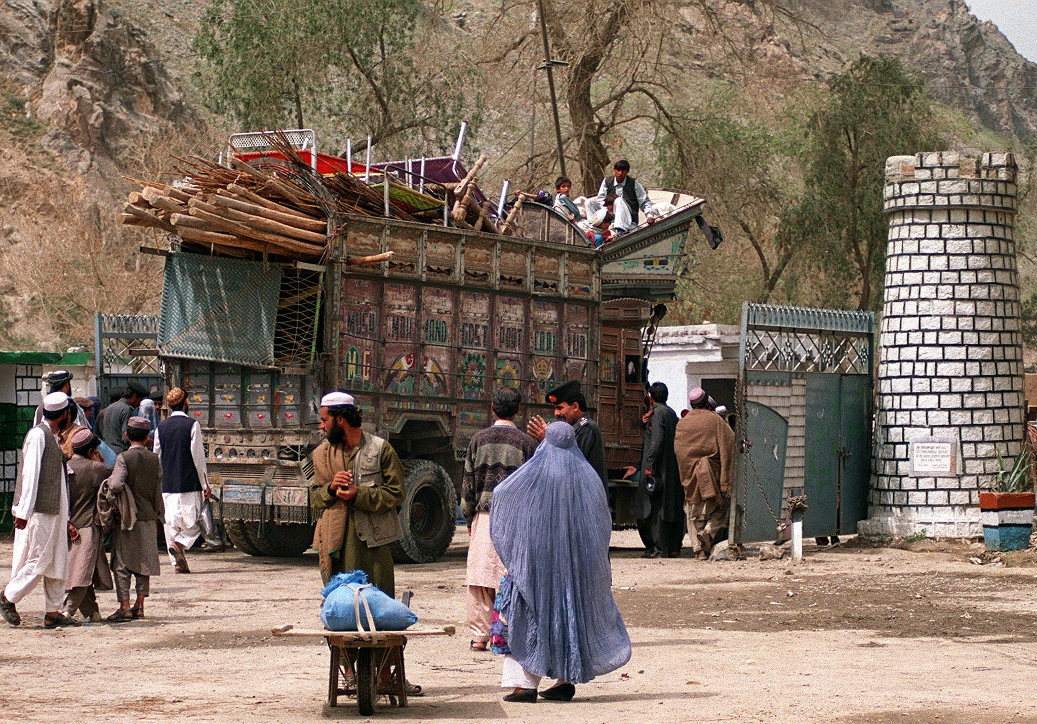 Refugees make the perilous journey back to Afghanistan aboard a rickety truck