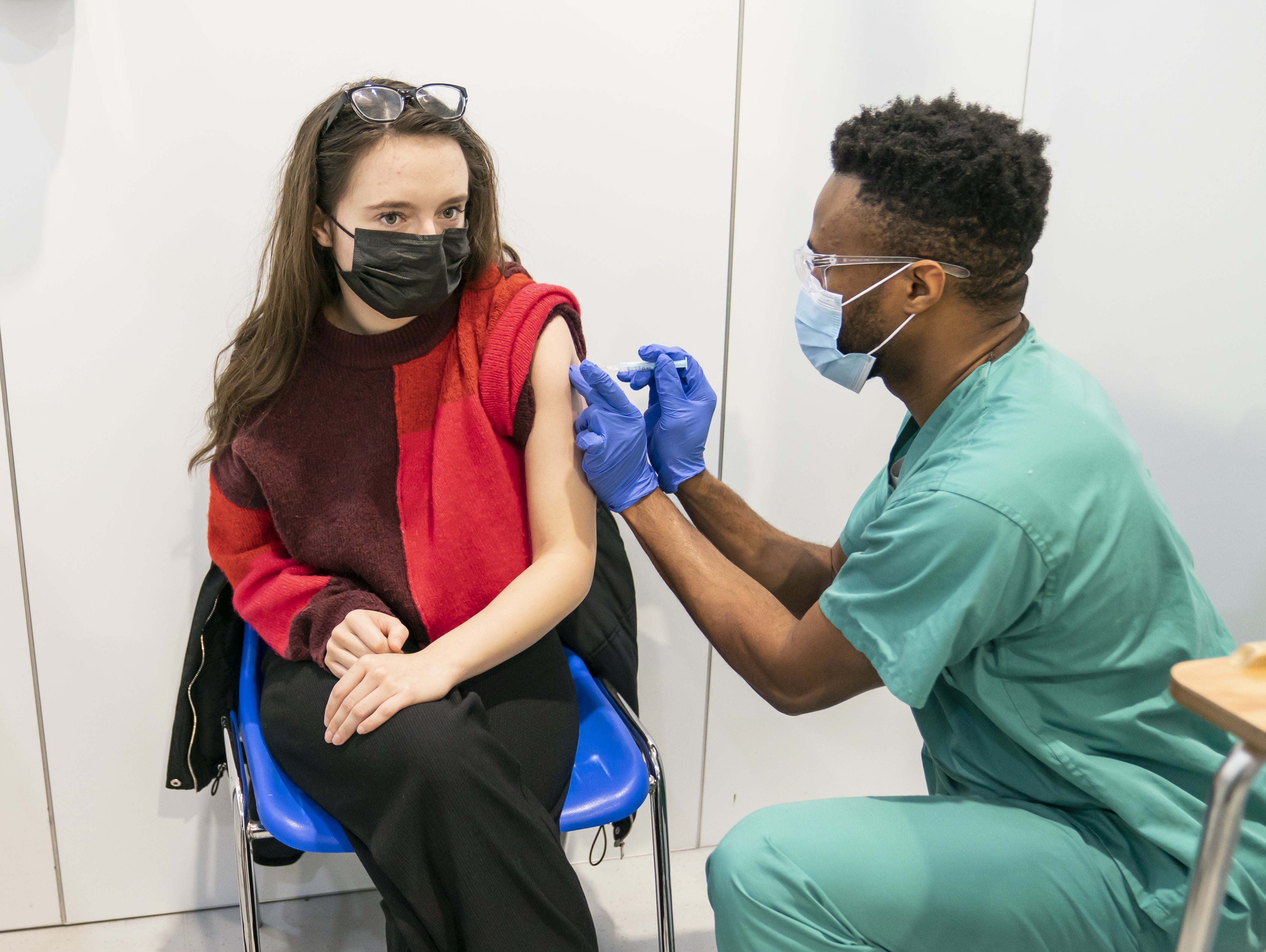 An associate practitioner administers a coronavirus vaccine at Elland Road in Leeds