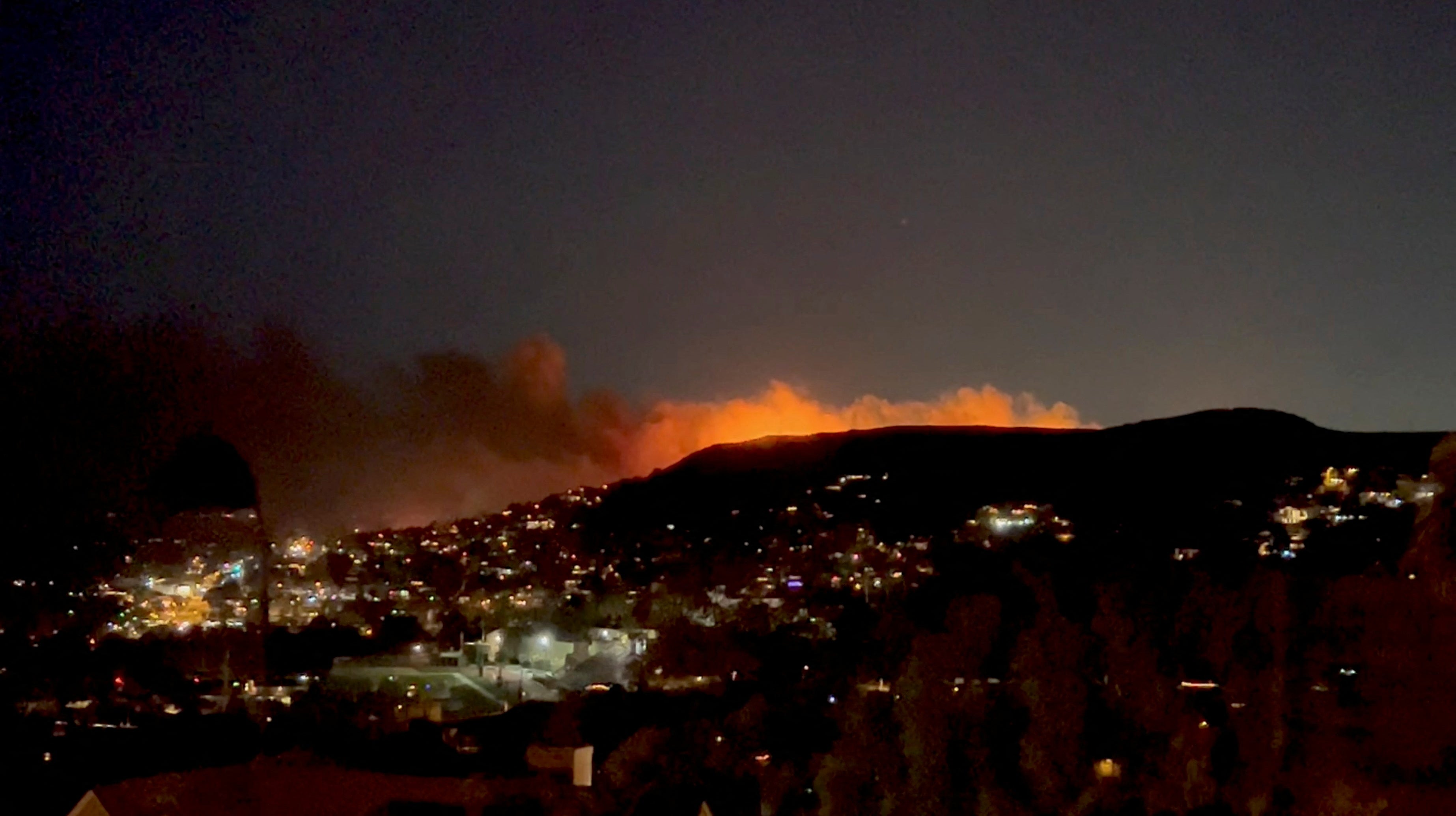 The Emerald Fire is seen before sunrise on 10 February 2022 in Laguna Beach, California