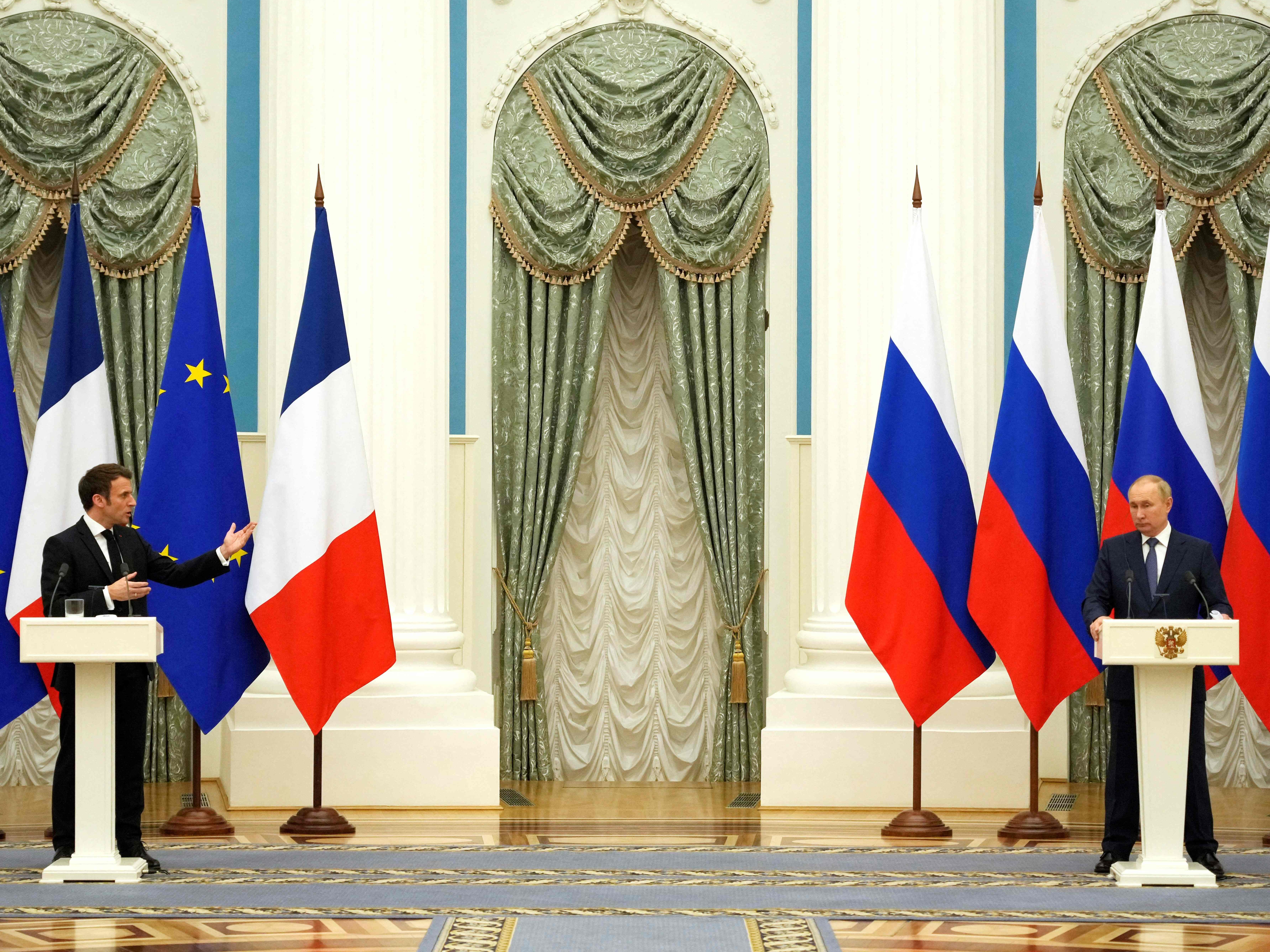 Russian President Vladimir Putin (R) listens during a joint press conference with French President Emmanuel Macron in Moscow, on 7 February 2022