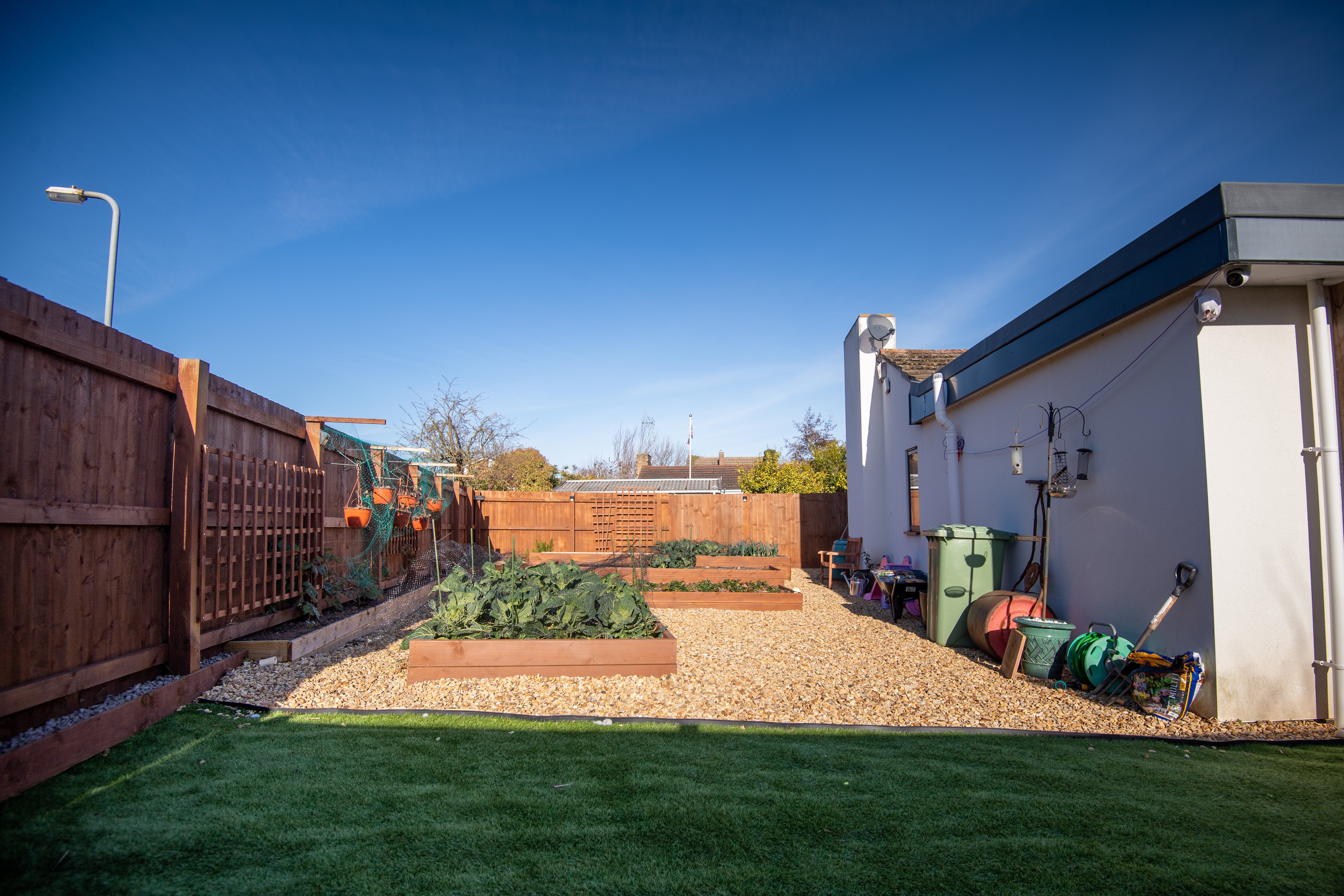 The couple decided to transform part of their lawn into raised beds so they would have more room to grow their own vegetables