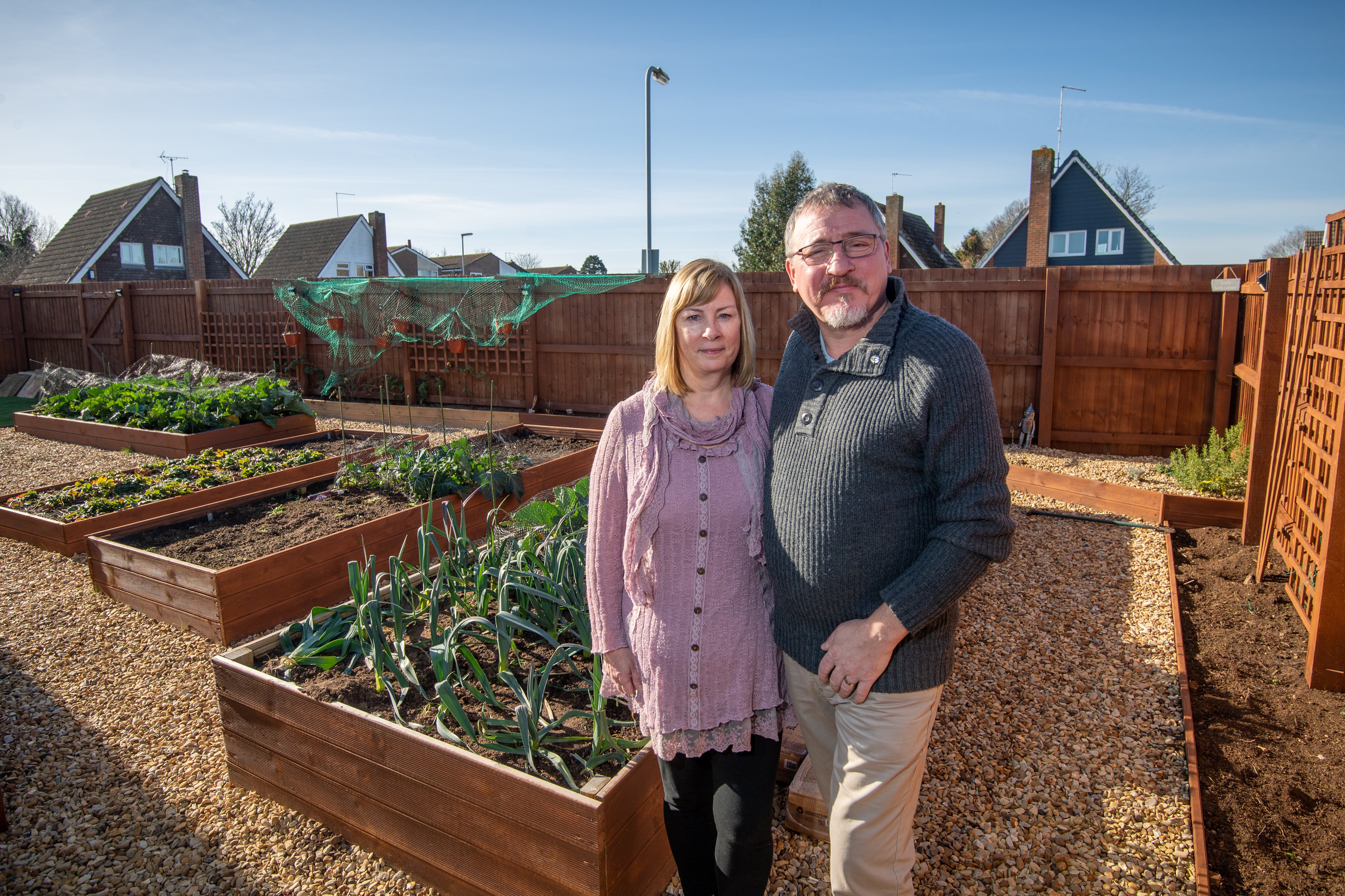 Lee and Kirstie Lawes in thier garden at their home Deeping St James, Lincolnshire