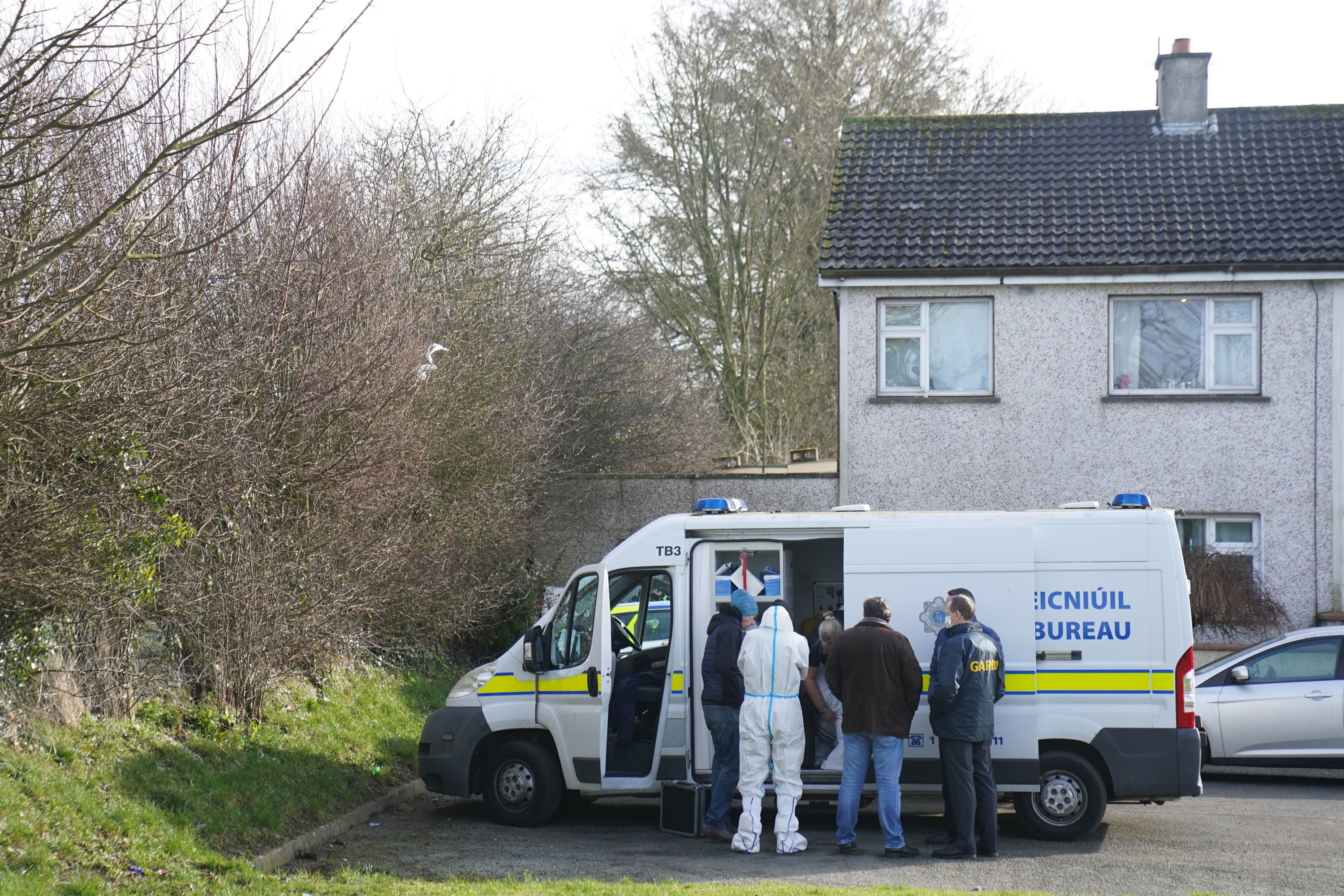 Gardai at the scene in Ballyconnell where a man was found dead (Brian Lawless/PA)