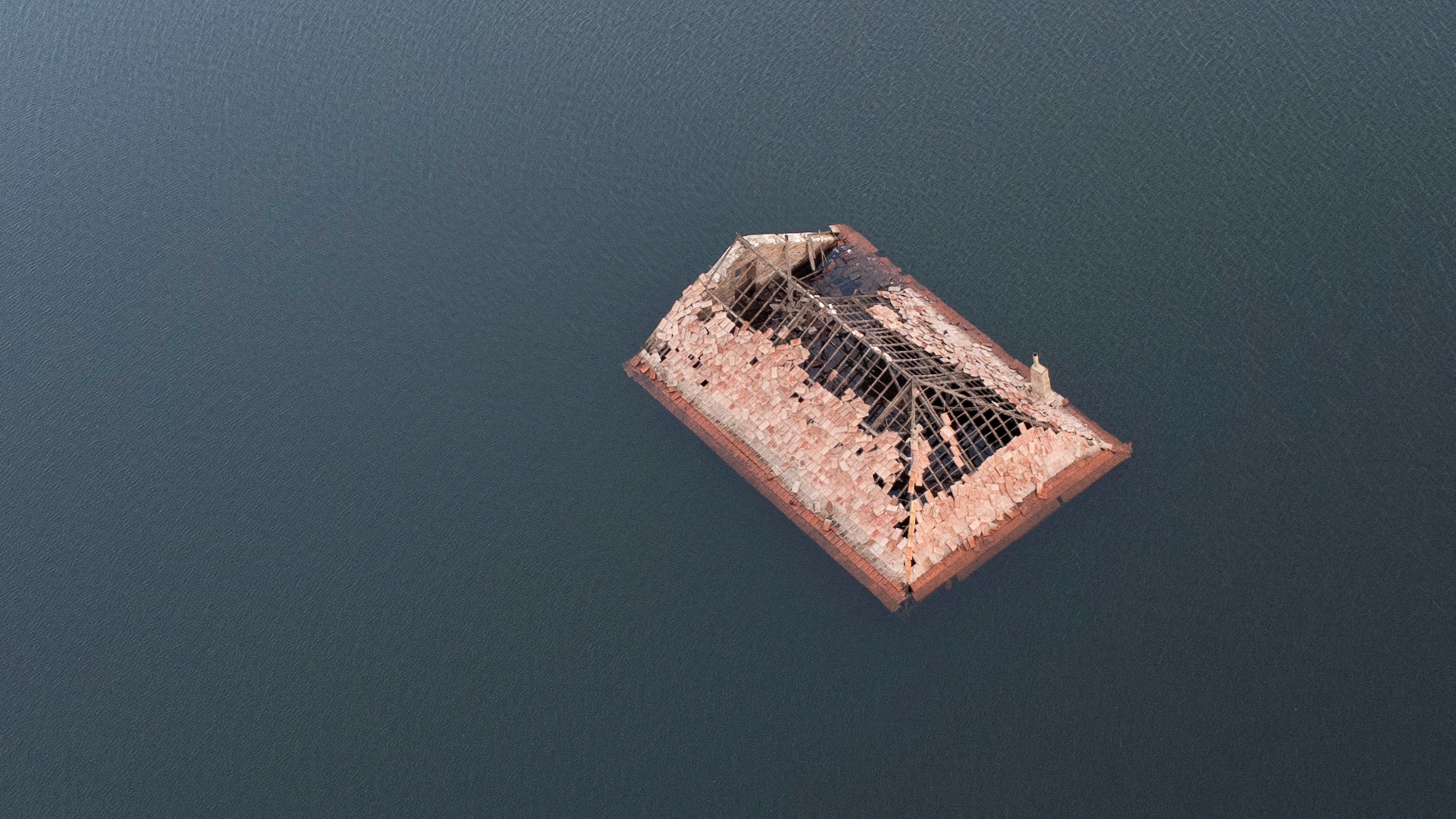 The roof of a house is seen in the ancient village of Aceredo that had been submerged by Limia river in the 1990s.