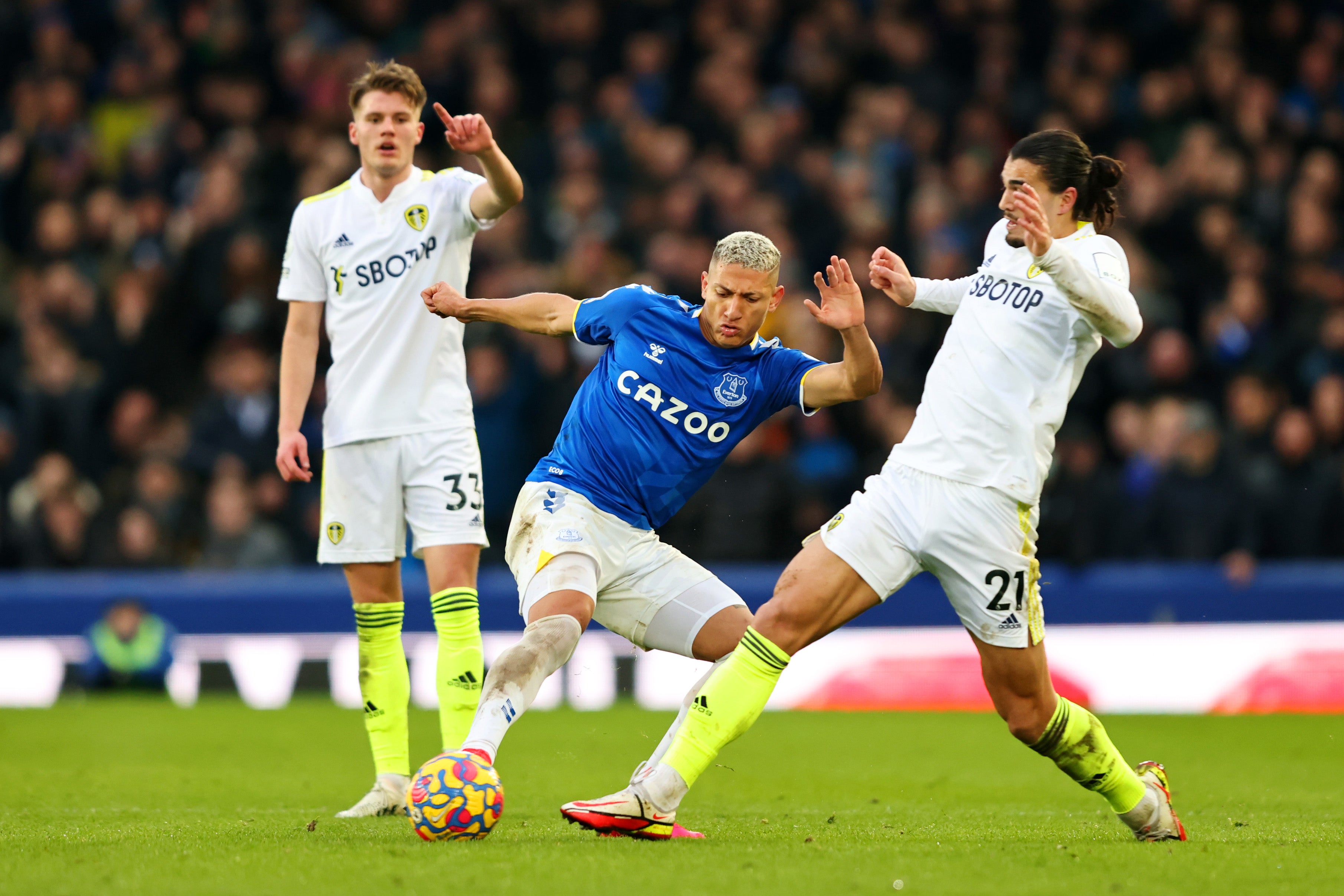 Richarlison battles for the ball