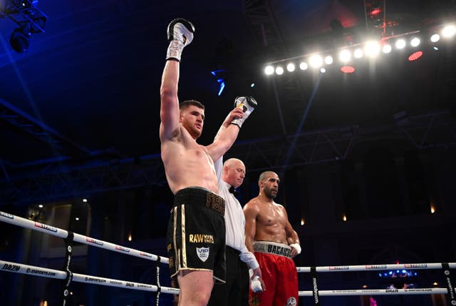 <p>Johnny Fisher celebrates his points victory over Gabriel Enguema</p>
