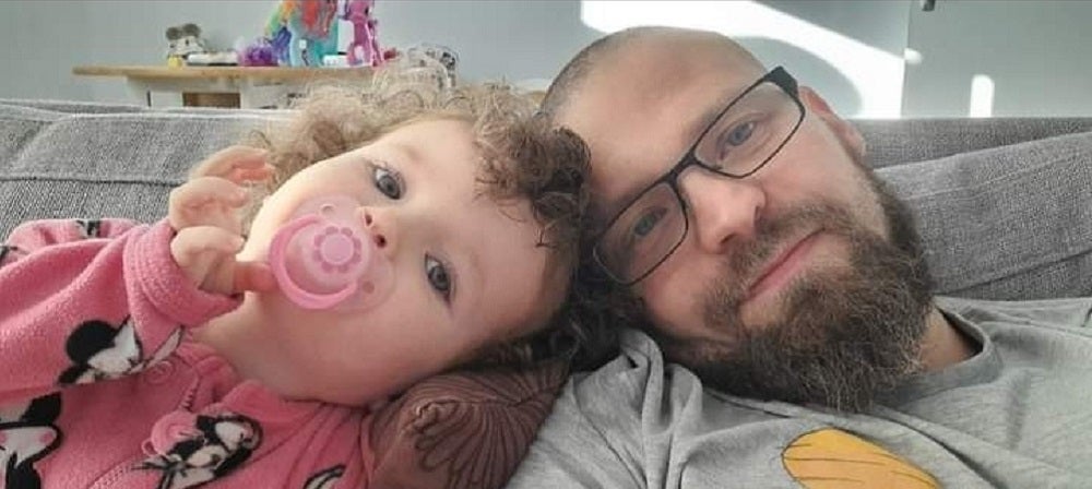 Mark Cummins, 37, with his two-year-old daughter Shannon, whom he resuscitated with the help of an emergency phone operator after she stopped breathing (Mark Cummins/PA)