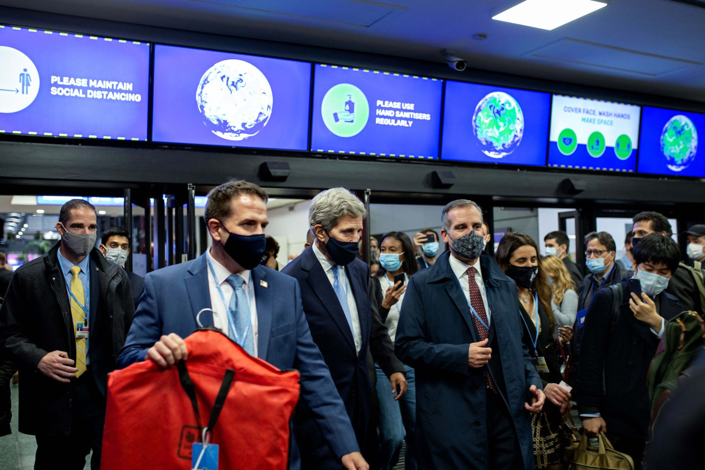 John Kerry, US special presidential envoy for climate, center, during the Cop26 climate talks in Glasgow