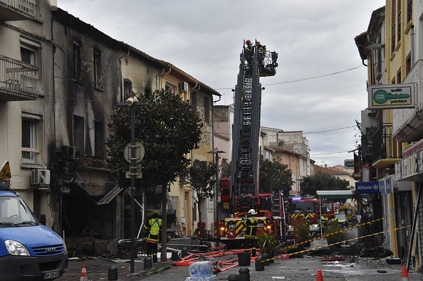 Rescue teams search the rubble for missing residents