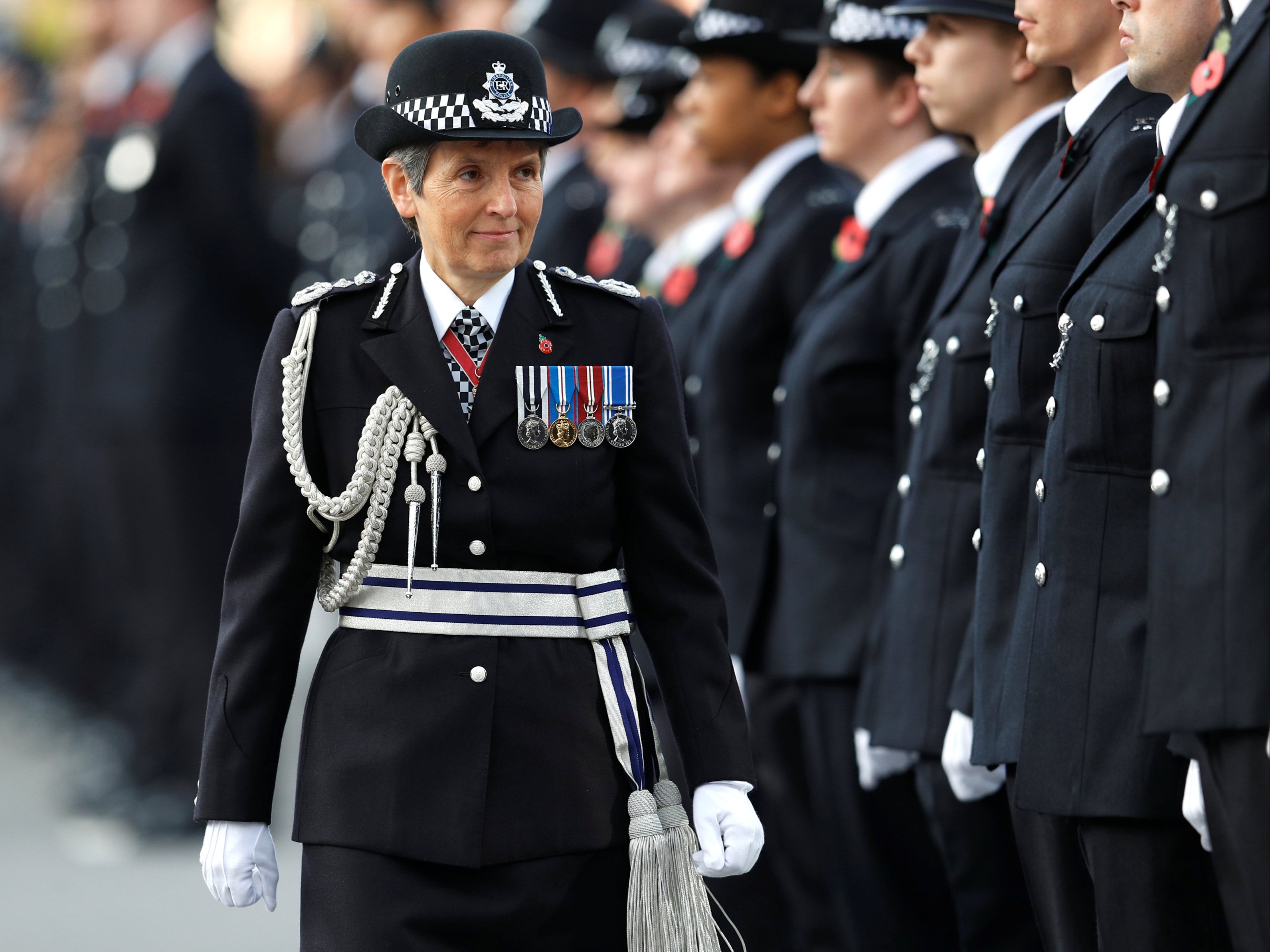 Former Metropolitan Police Commissioner Cressida Dick inspects police cadets at a passing out parade in Hendon