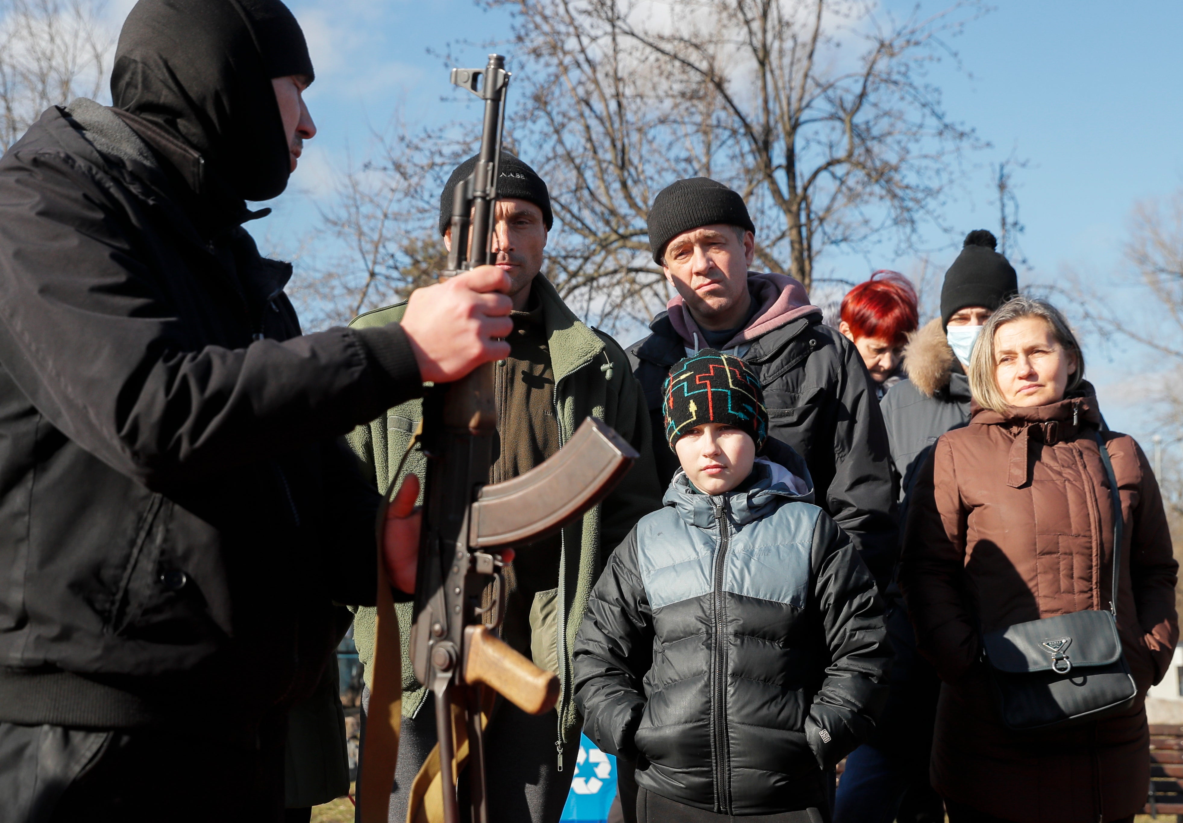 Ukrainians attend an open military training for civilians organized by Right Sector activists in Kiev
