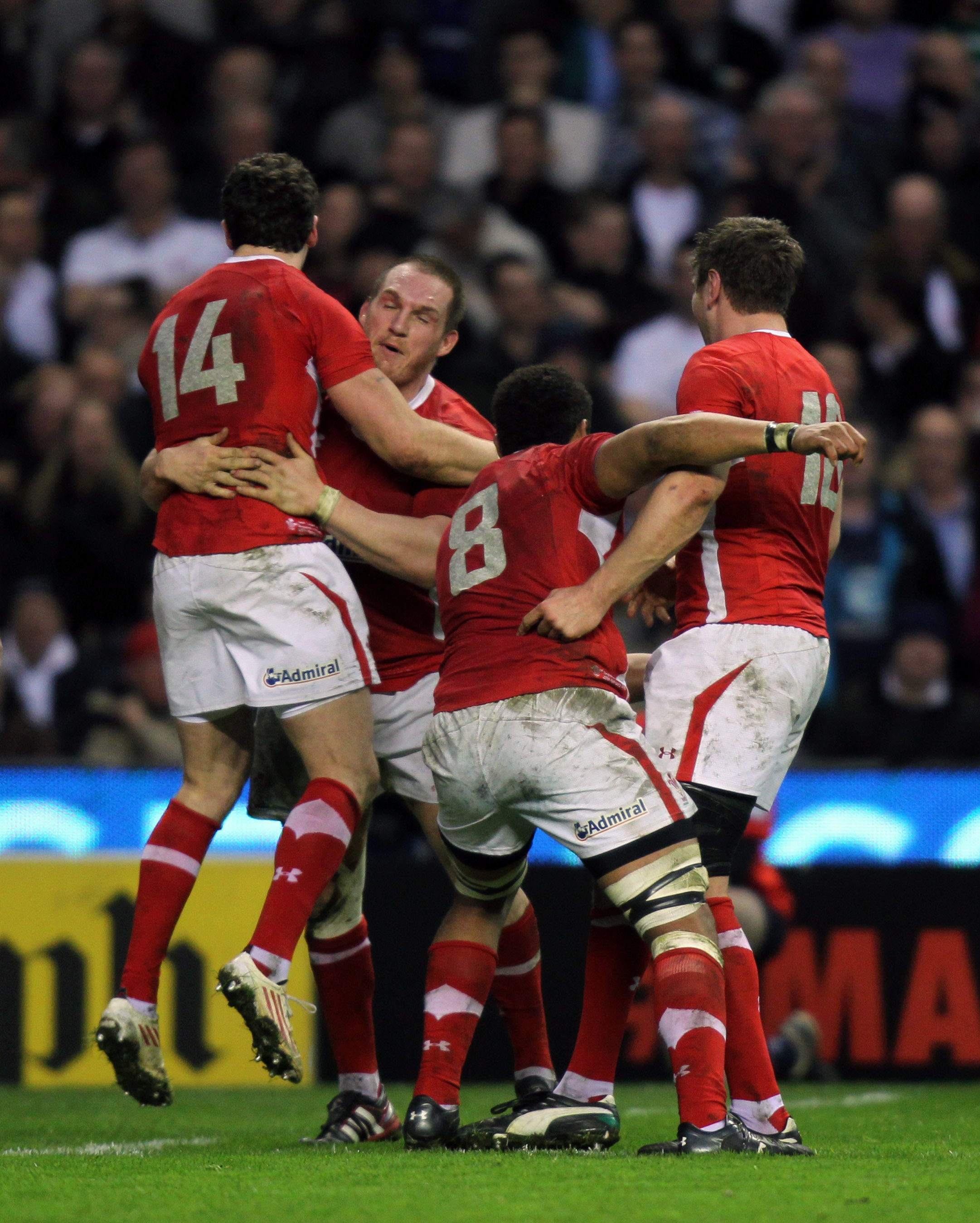 Wales players celebrate after beating England at Twickenham in 2012 (David Davies/PA)