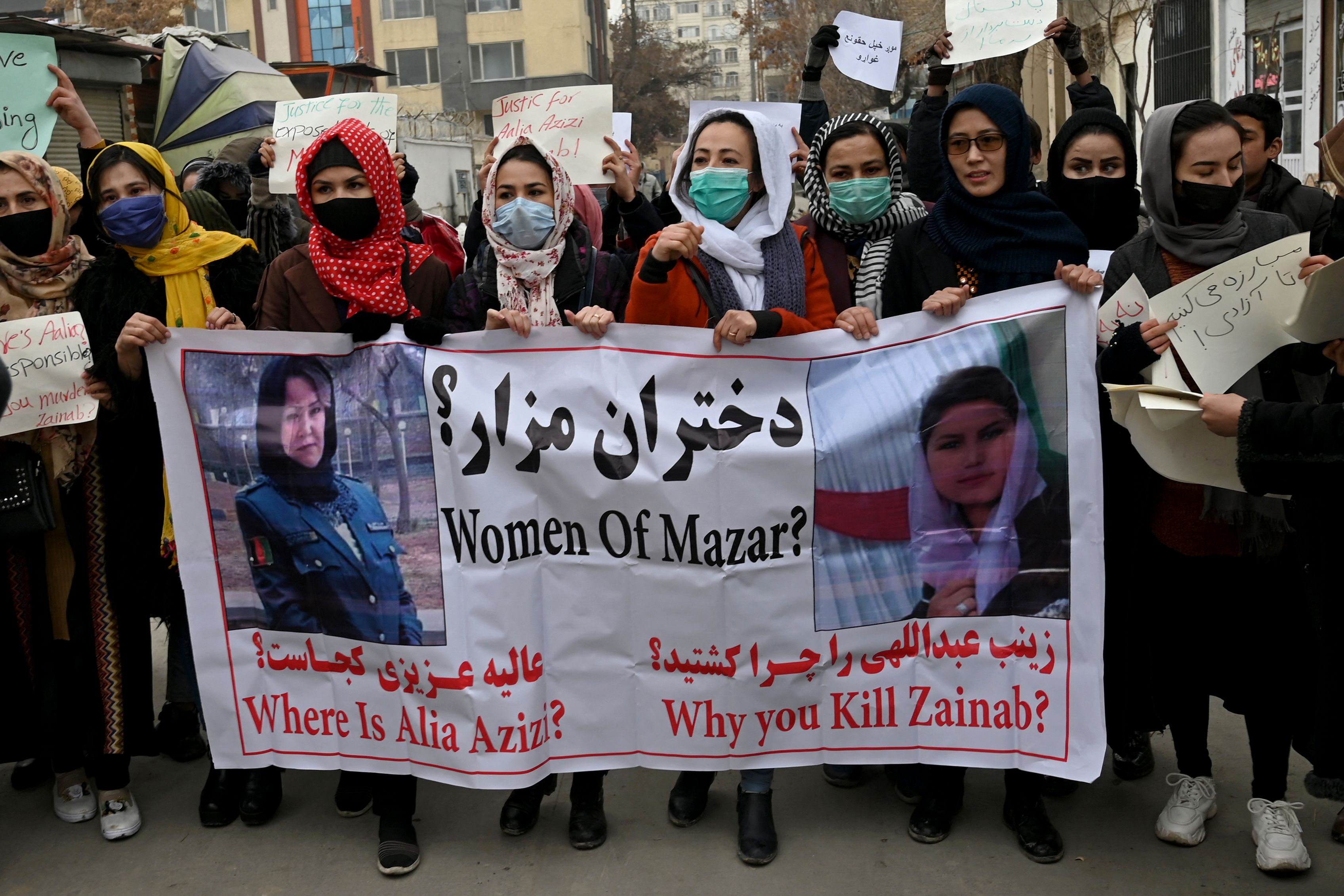 Afghan women march as they chant slogans and hold banners during a women’s rights protest in Kabul on 16 January 2022