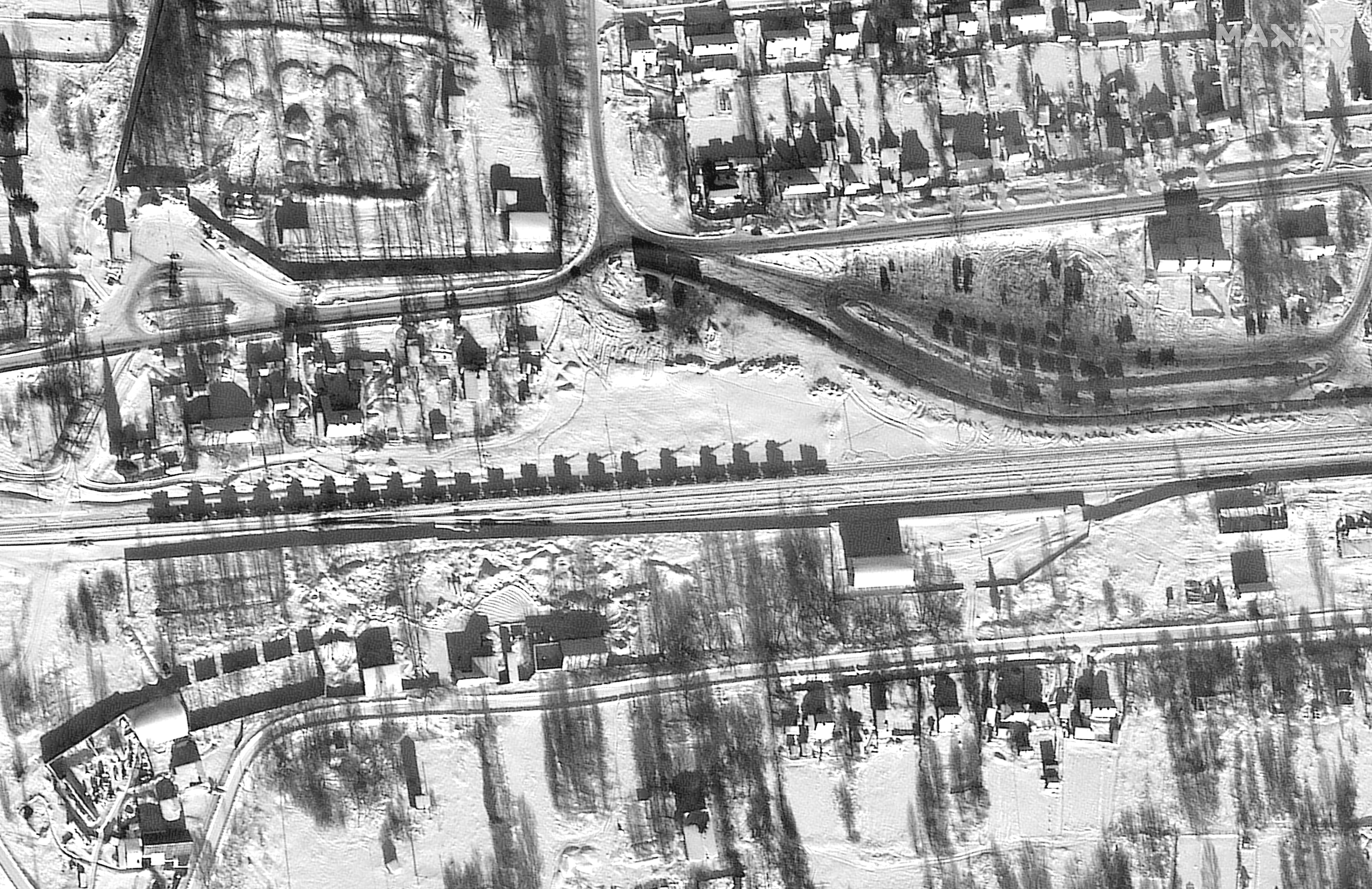 A satellite image provided by Maxar Technologies shows the armor and artillery loaded on flatcars and in a railyard in Yelnya, Russia