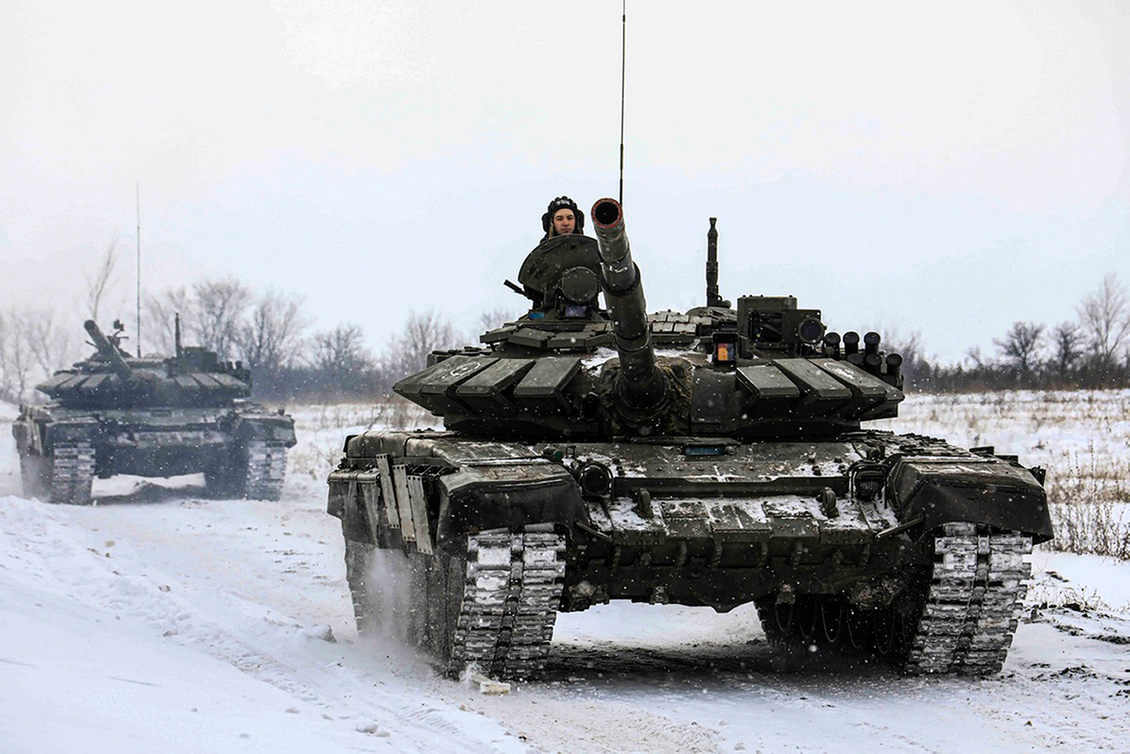 Russian tanks roll on the field during a military drills in Leningrad