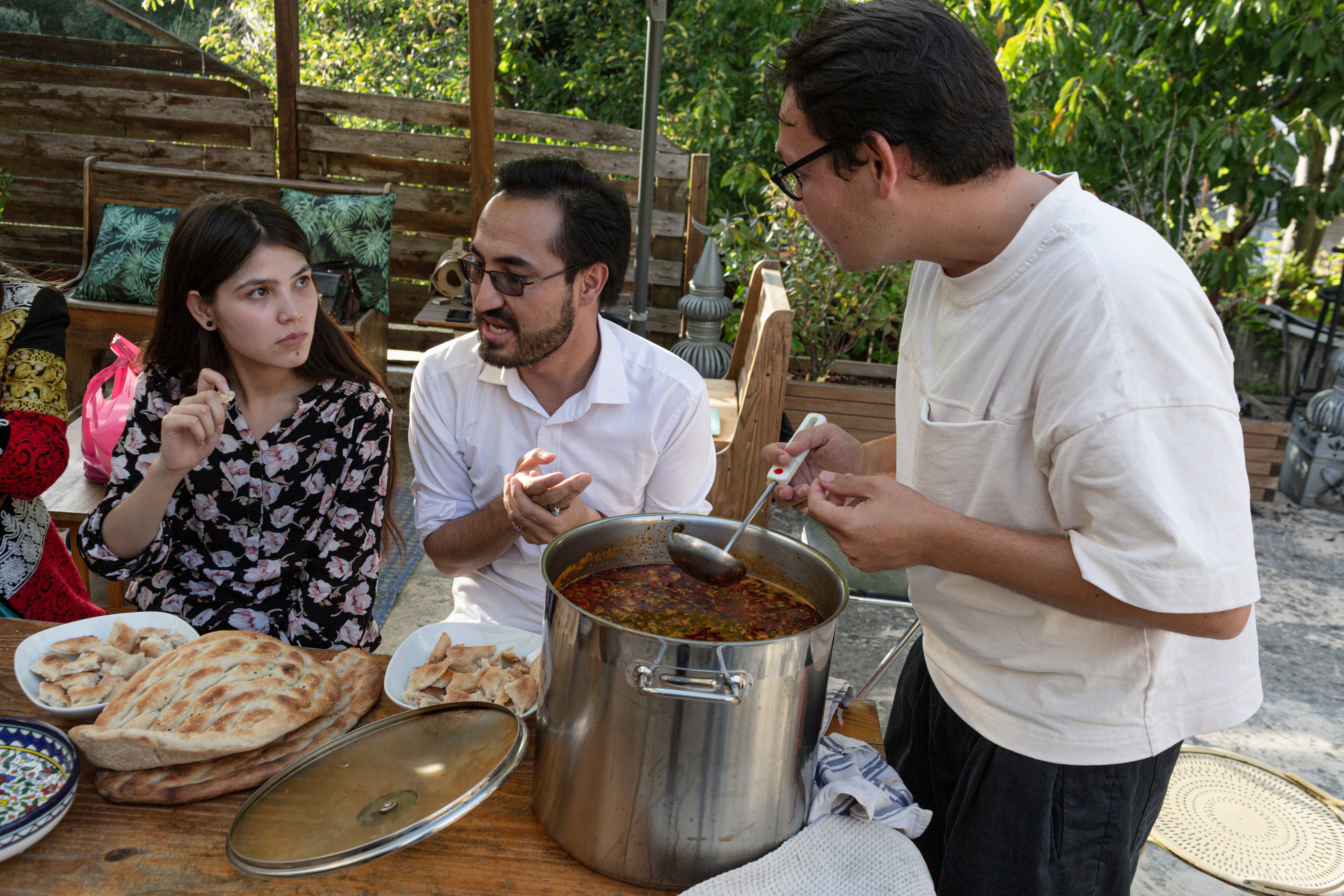 File photo: A dinner is hosted for Afghan refugees after they were evacuated from Kabul, on 7 September 2021, in Paris