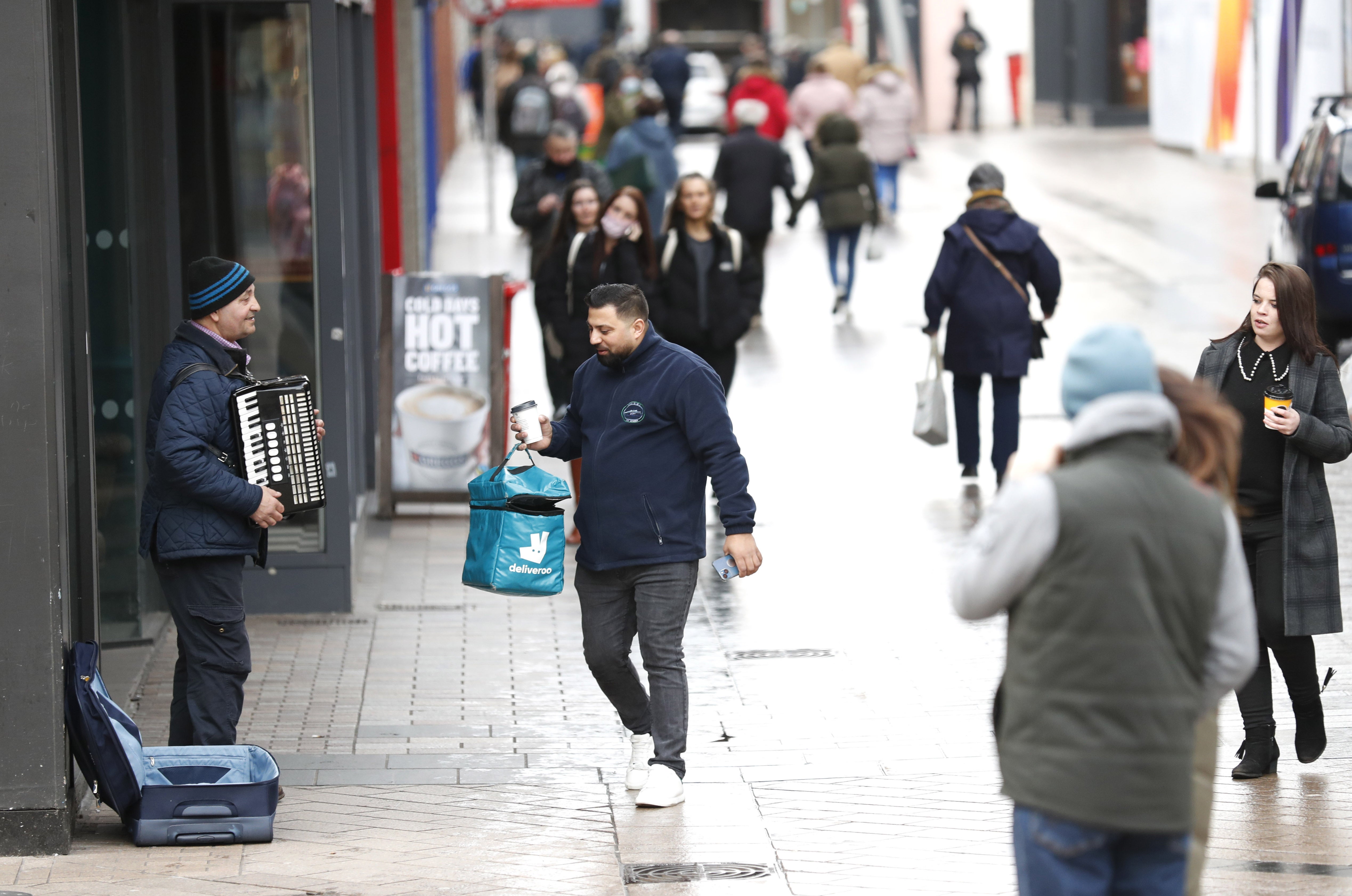 Shoppers go about their business in Belfast City Centre as Coronavirus legal restrictions are being lifted in Northern Ireland and being replaced with guidance (Peter Morrison/PA)