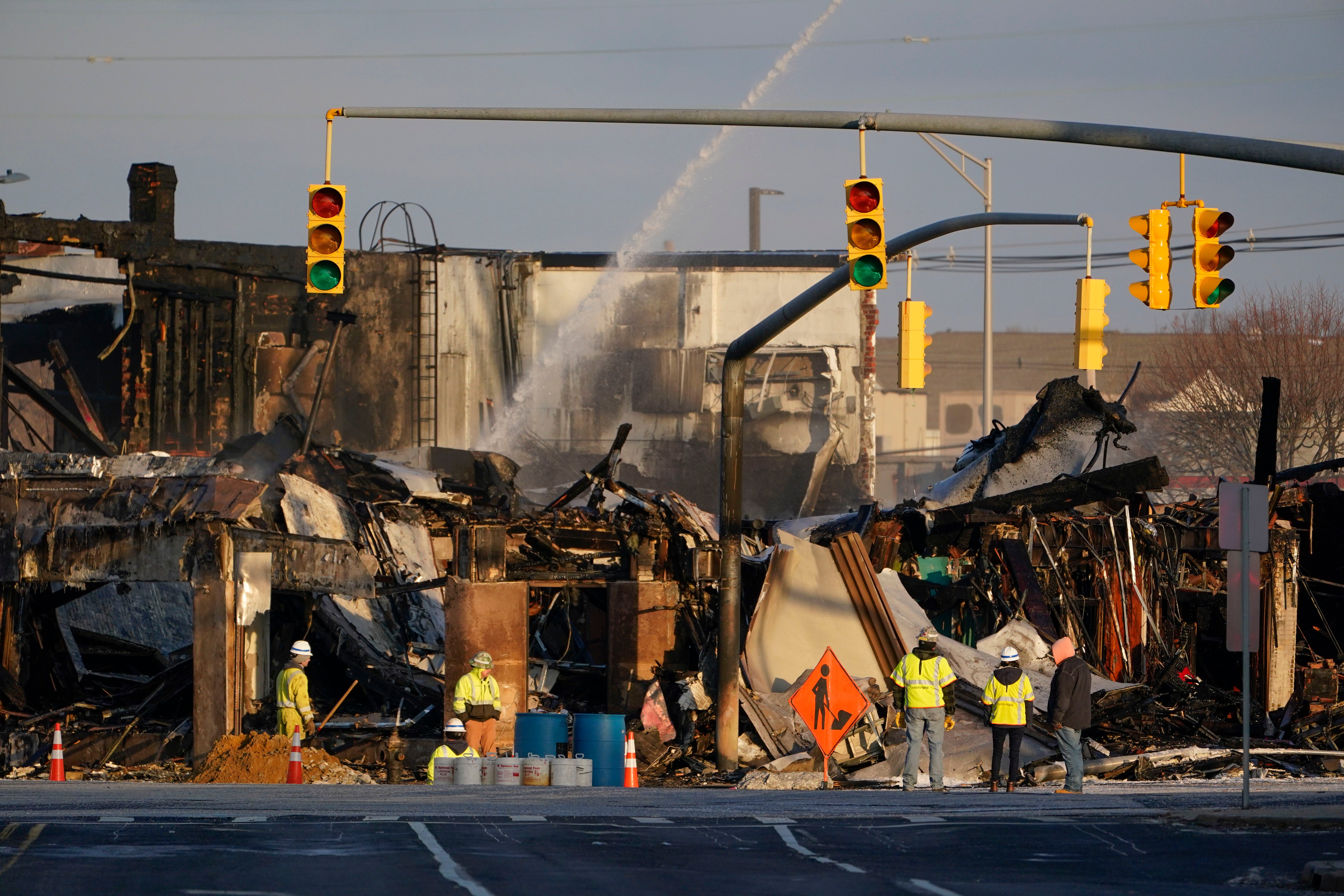 Emergency personnel work at the site of gas tanker accident in Rockville Centre, N.Y., early Wednesday, Feb. 16, 2022