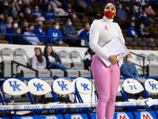 College basketball coach hits back at sexist attacks over her pink leather game day outfit 