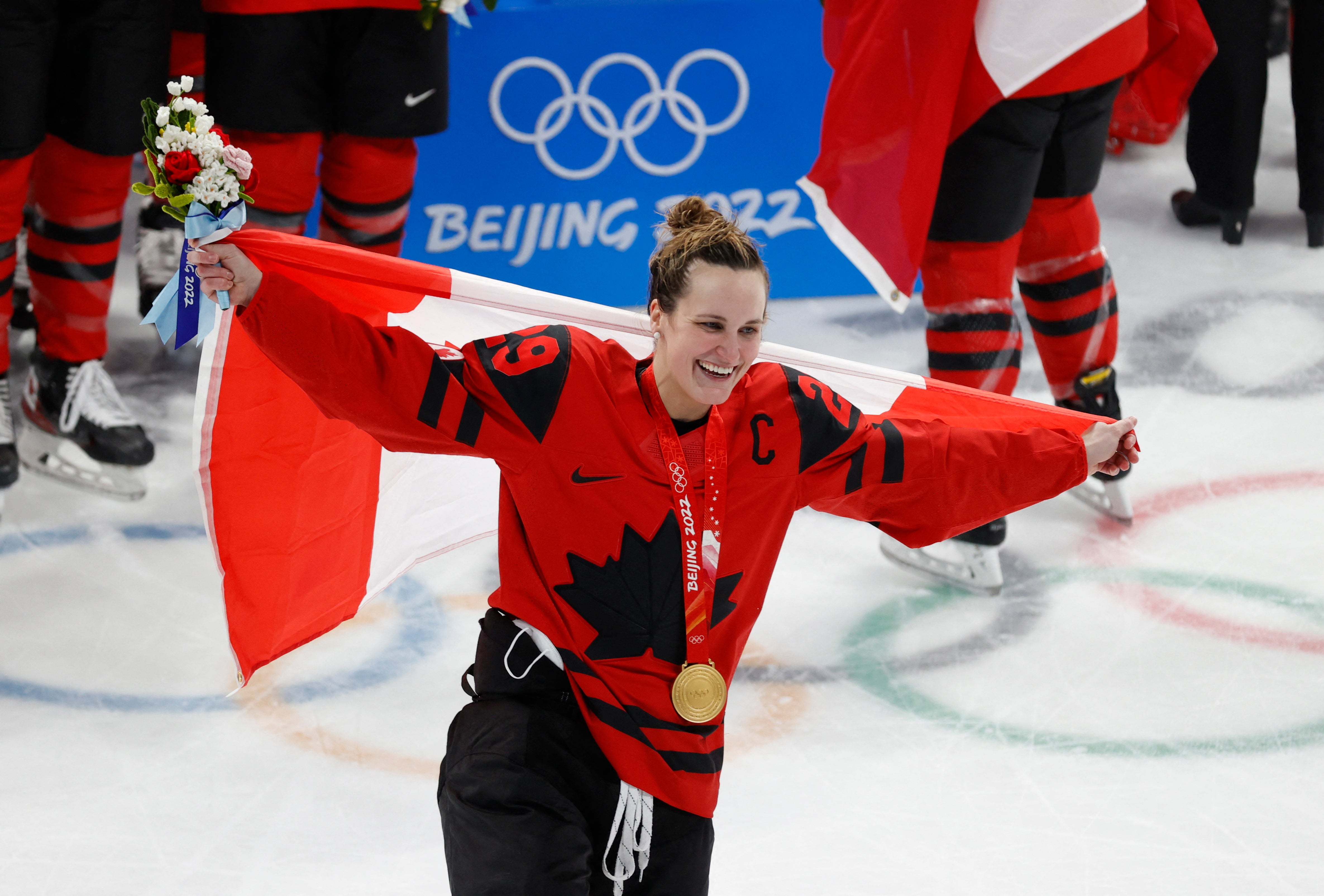 Marie-philip Poulin of Canada celebrates with a gold medal