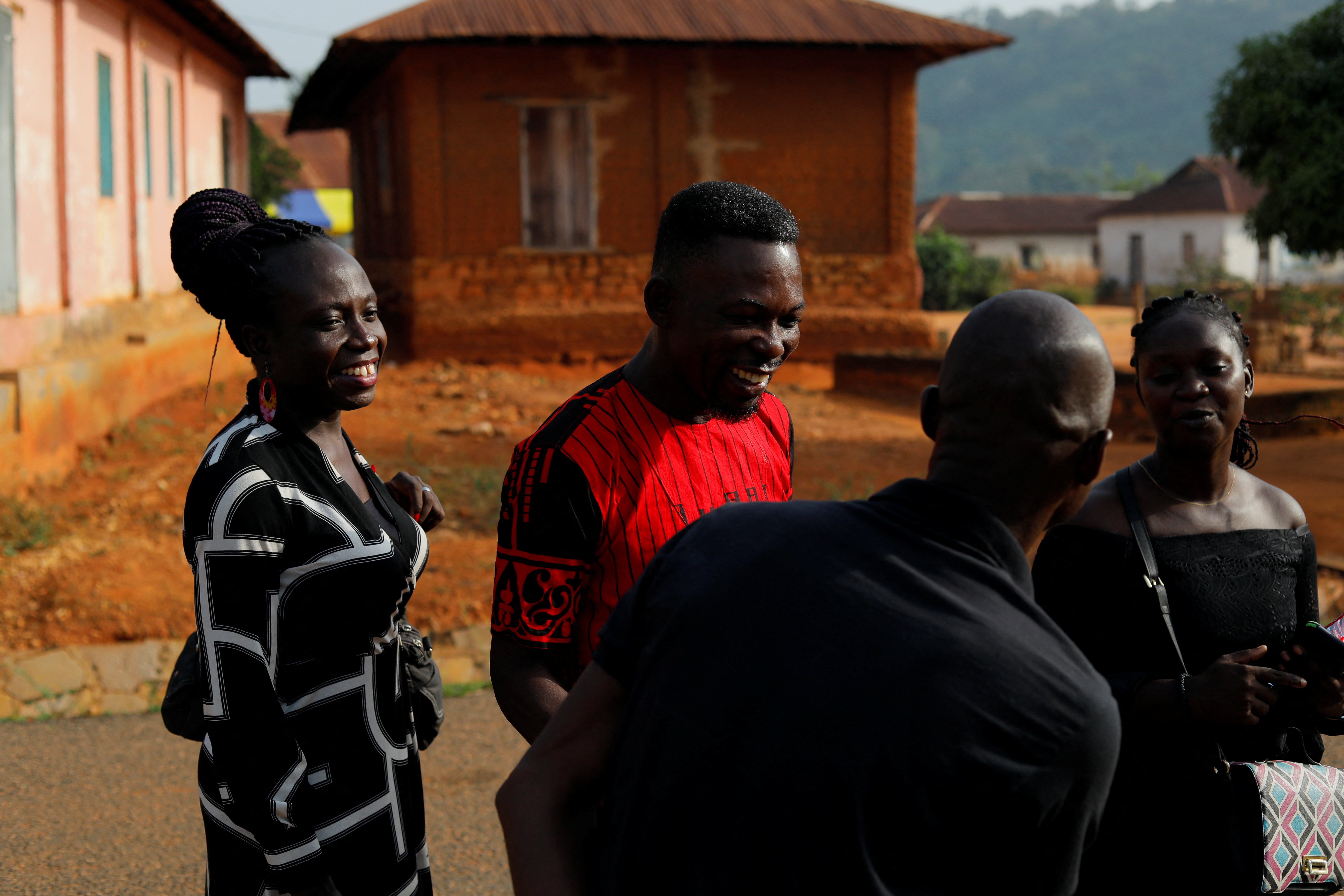 Fiatsi and her brother, Prince Fiatsi, 47, greet people as they arrive at their family’s village for the funeral of a their grandmother