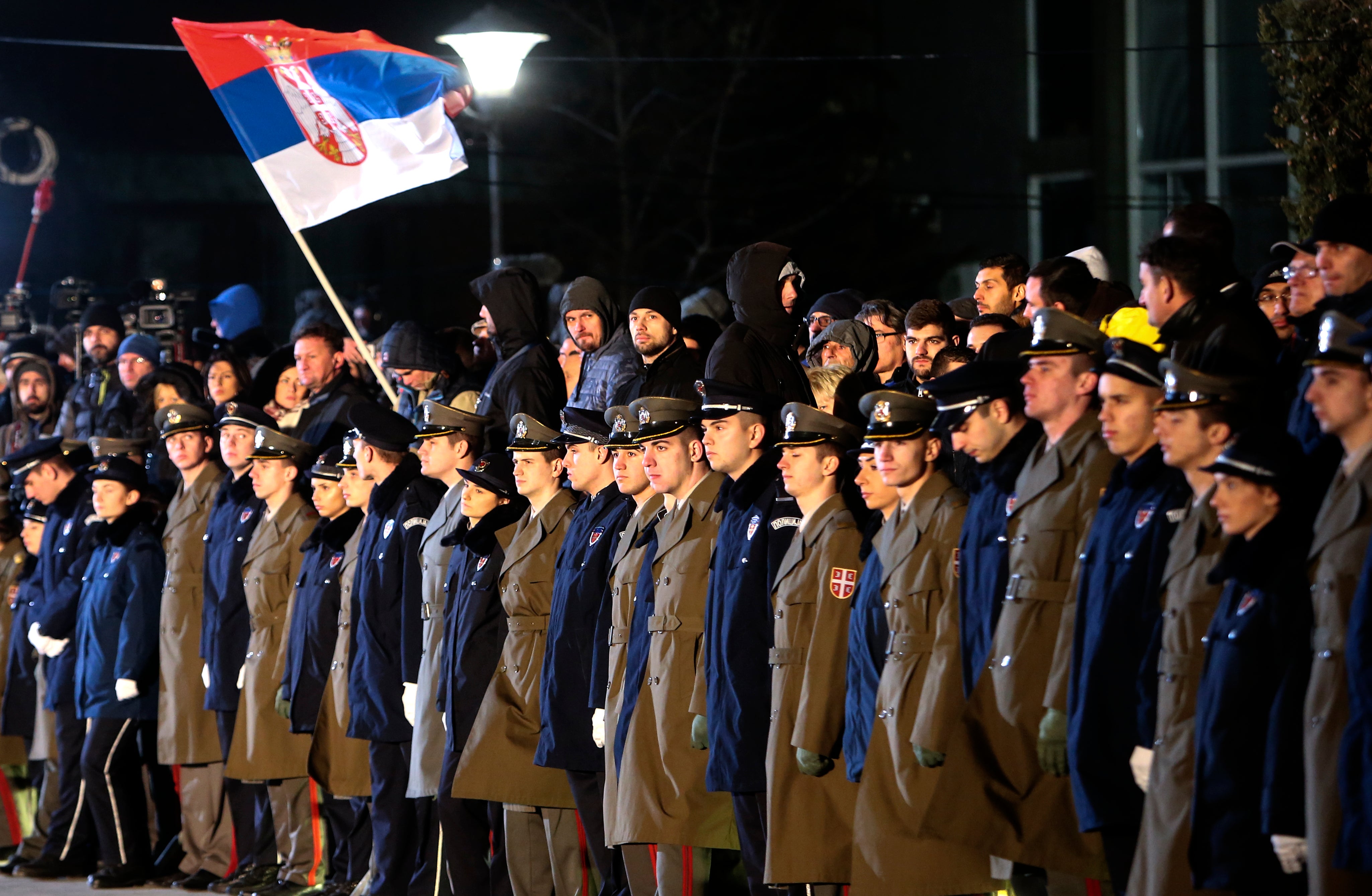 Serbian military officers line up for a visit by president Putin