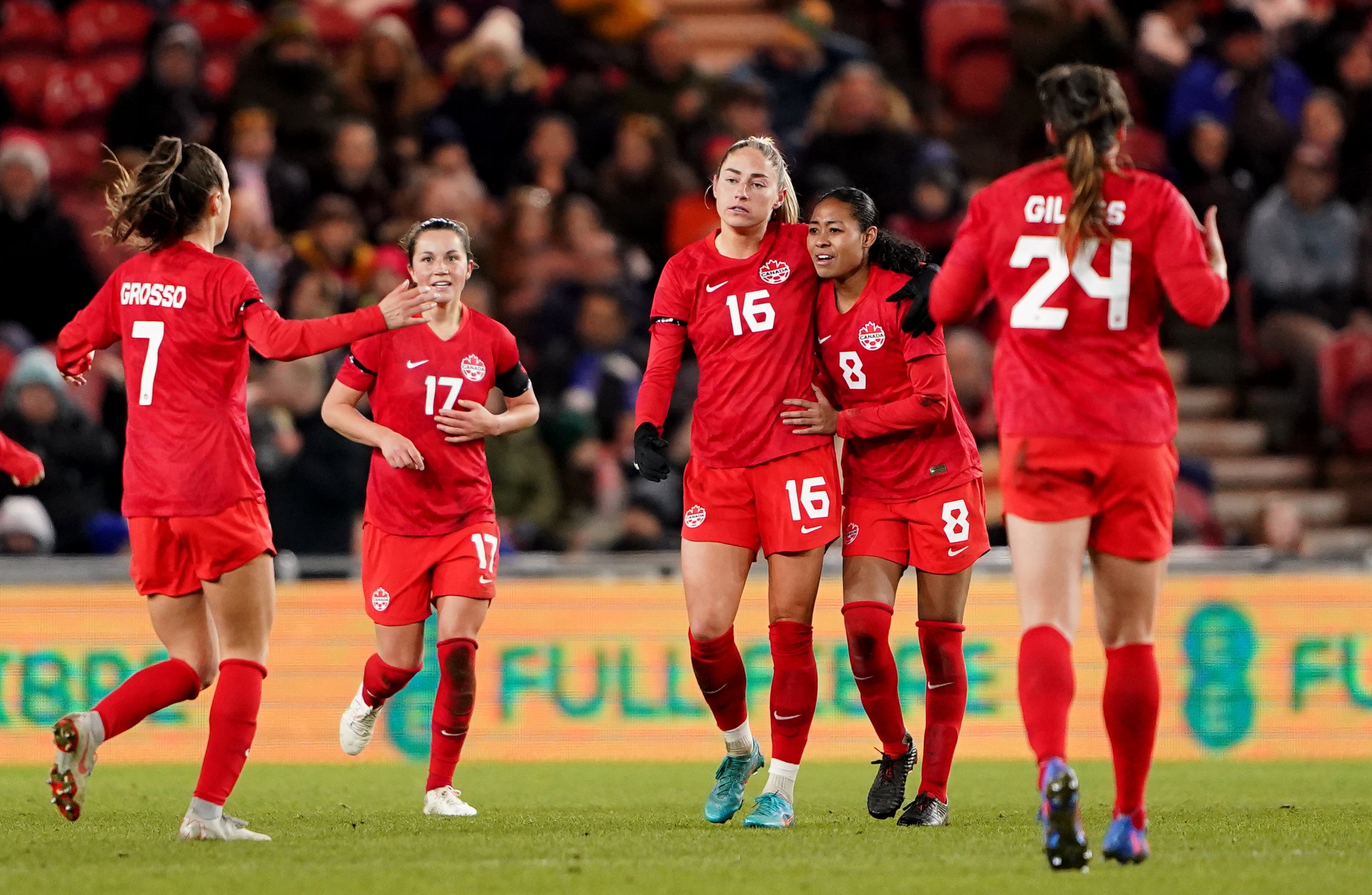 Janine Beckie (centre) claimed a draw for Canada (Zac Goodwin/PA)