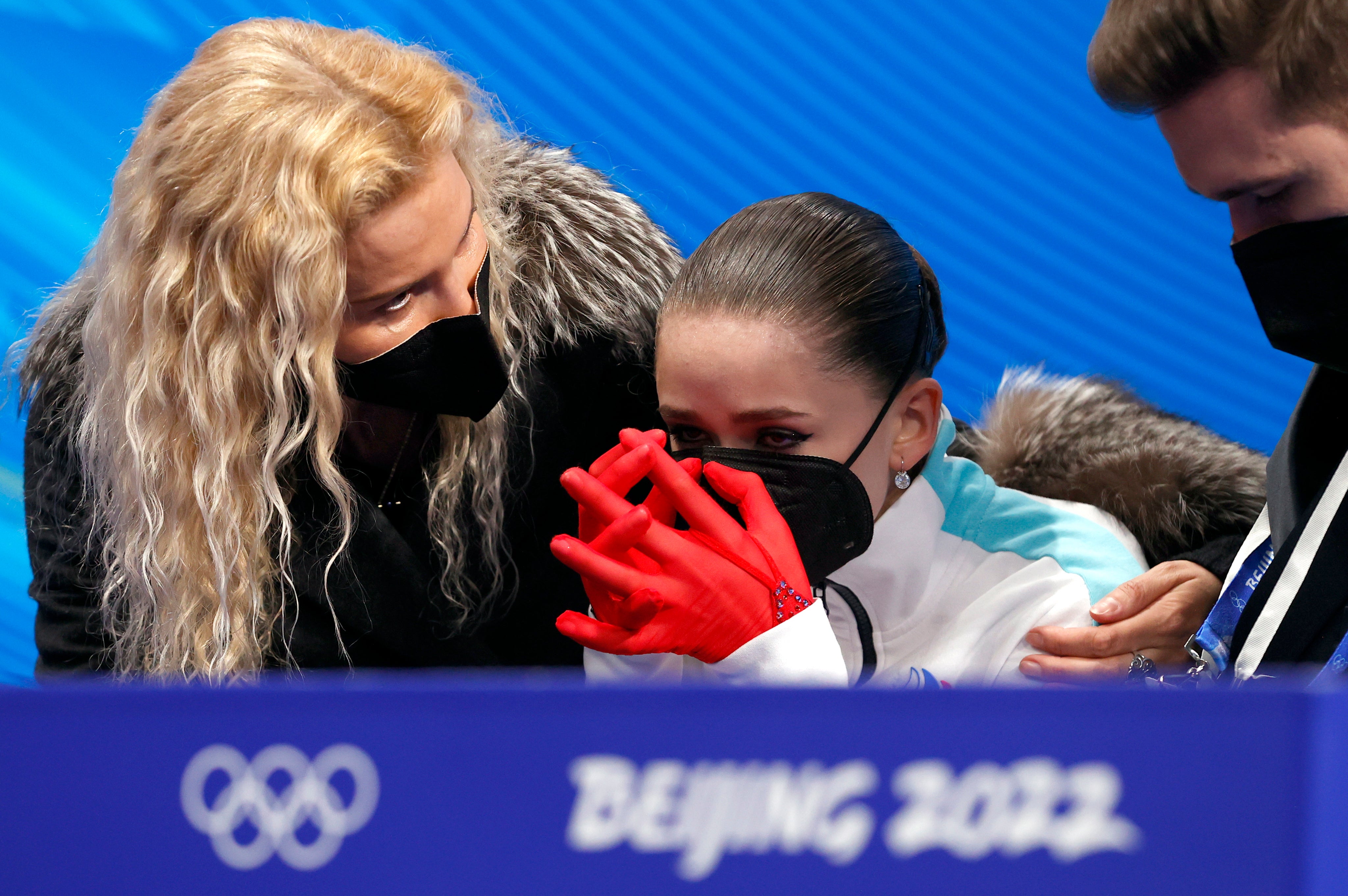 Kamila Valieva of Russian Olympic Committee cries next her coach Eteri Tutberidze