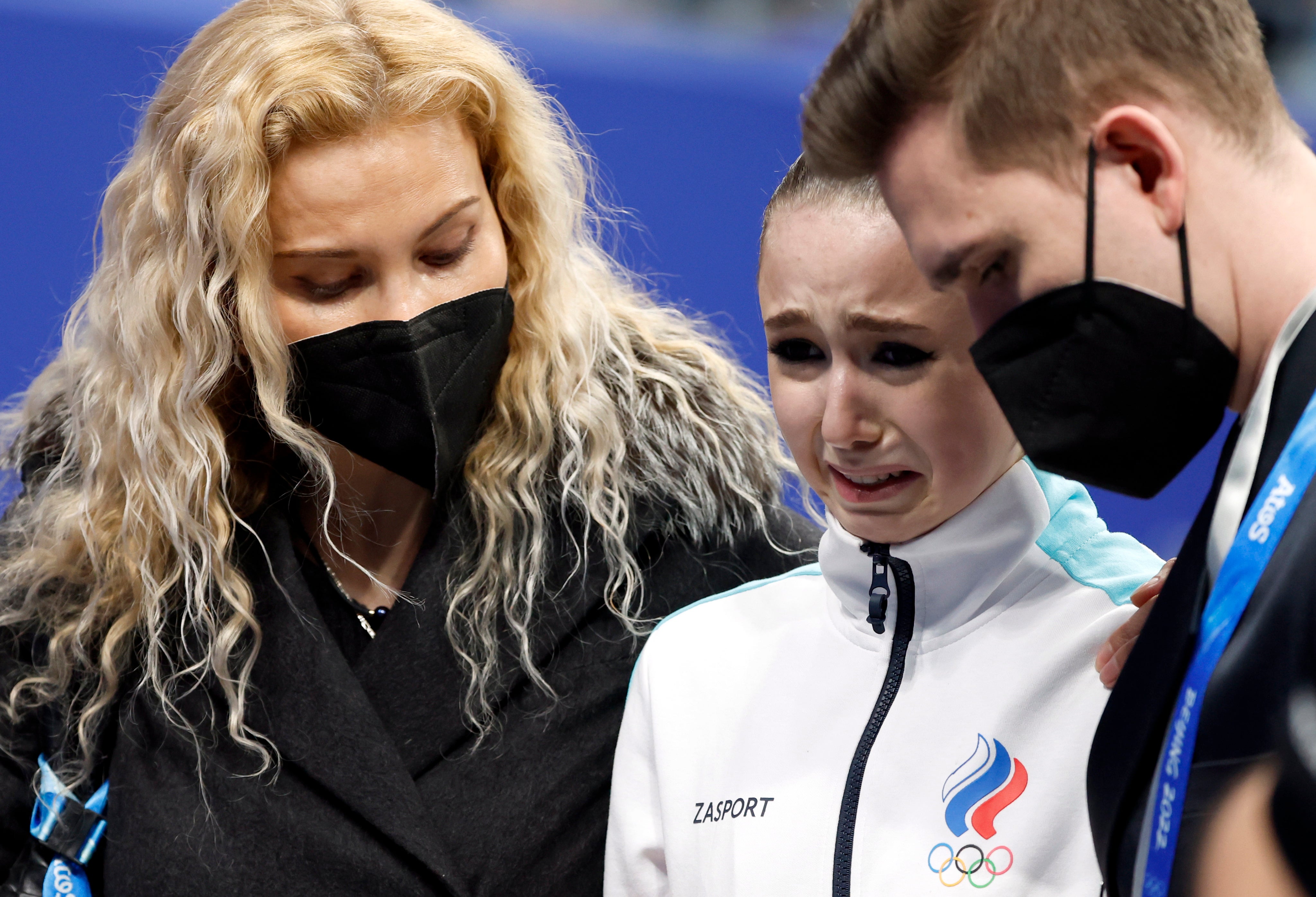 Kamila Valieva (C) of Russian Olympic Committee cries next her coach Eteri Tutberidze