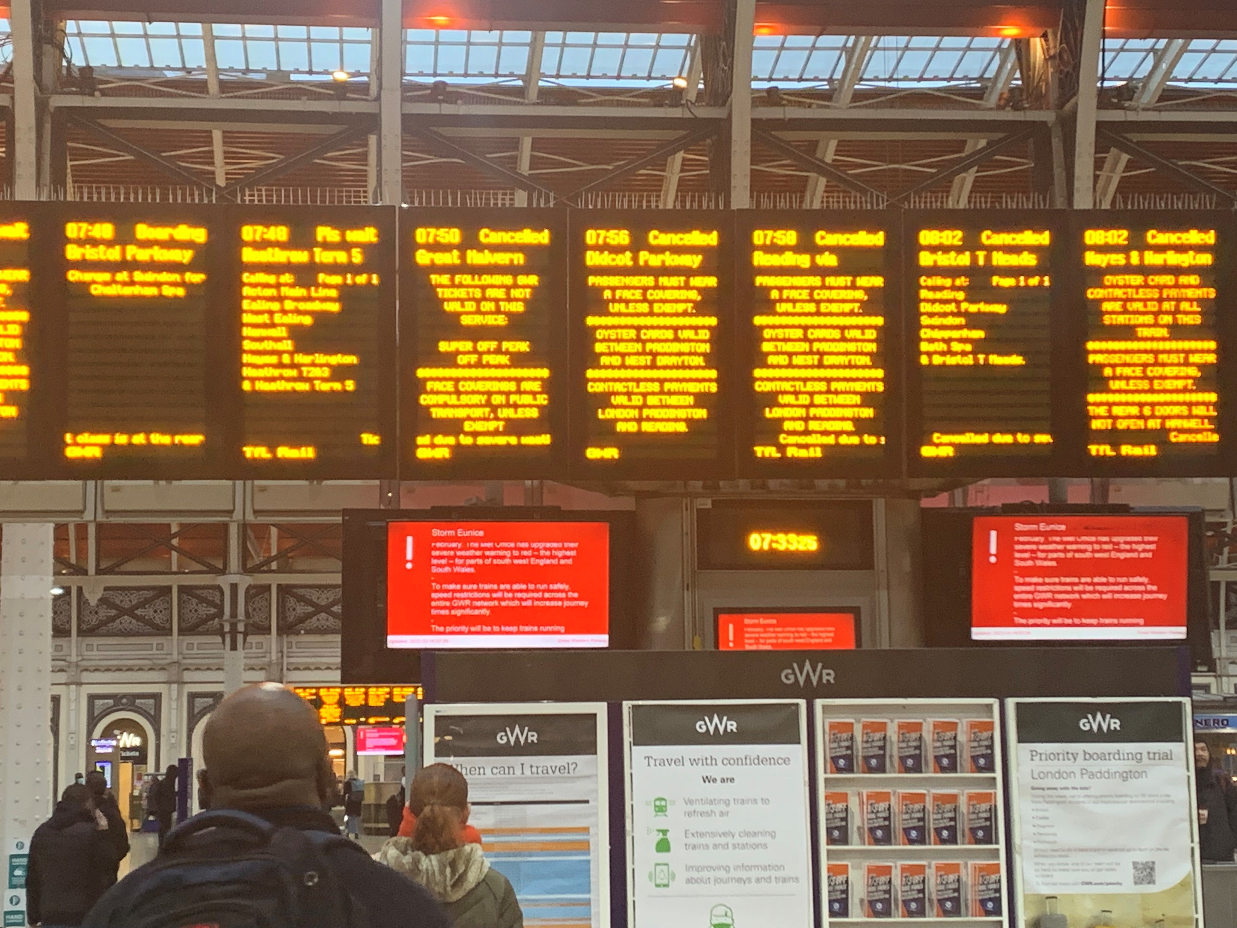 A sign at London's Paddington station shows cancelled trains after Storm Eunice hit the south coast