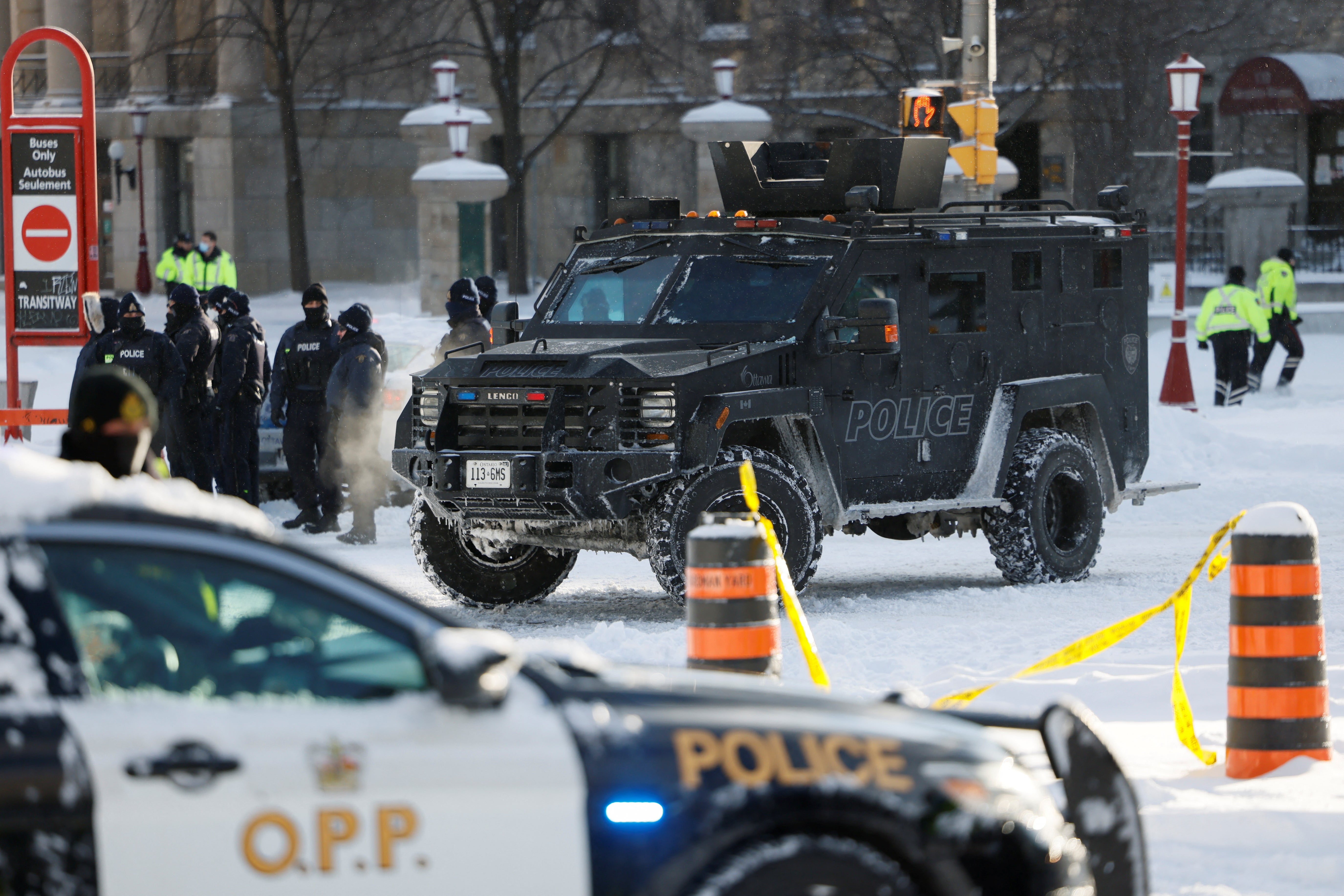 Police stand guard in the capital as protesters are arrested