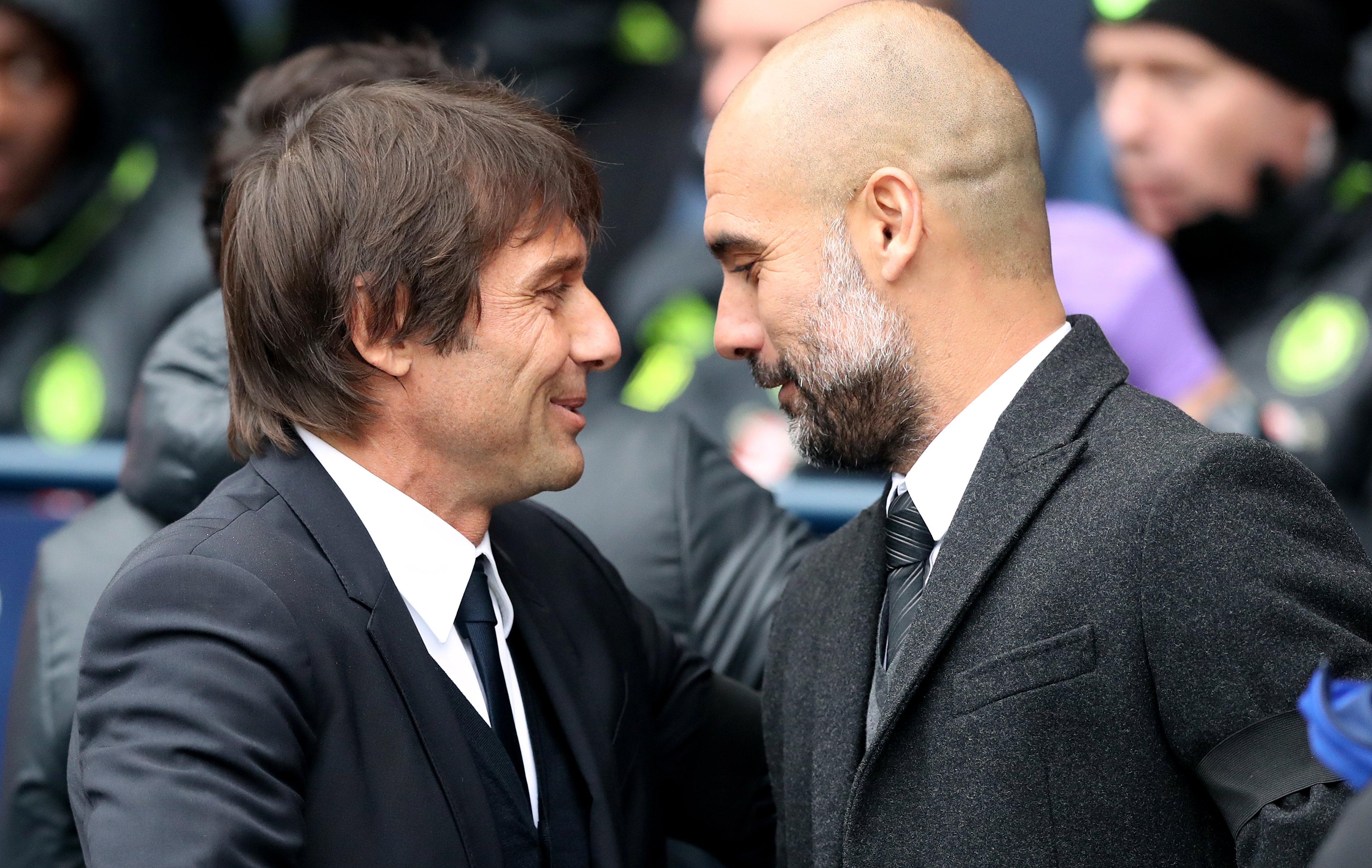 Pep Guardiola (right) and Antonio Conte (left) will go head to head when Manchester City host Tottenham on Saturday (Martin Rickett/PA).