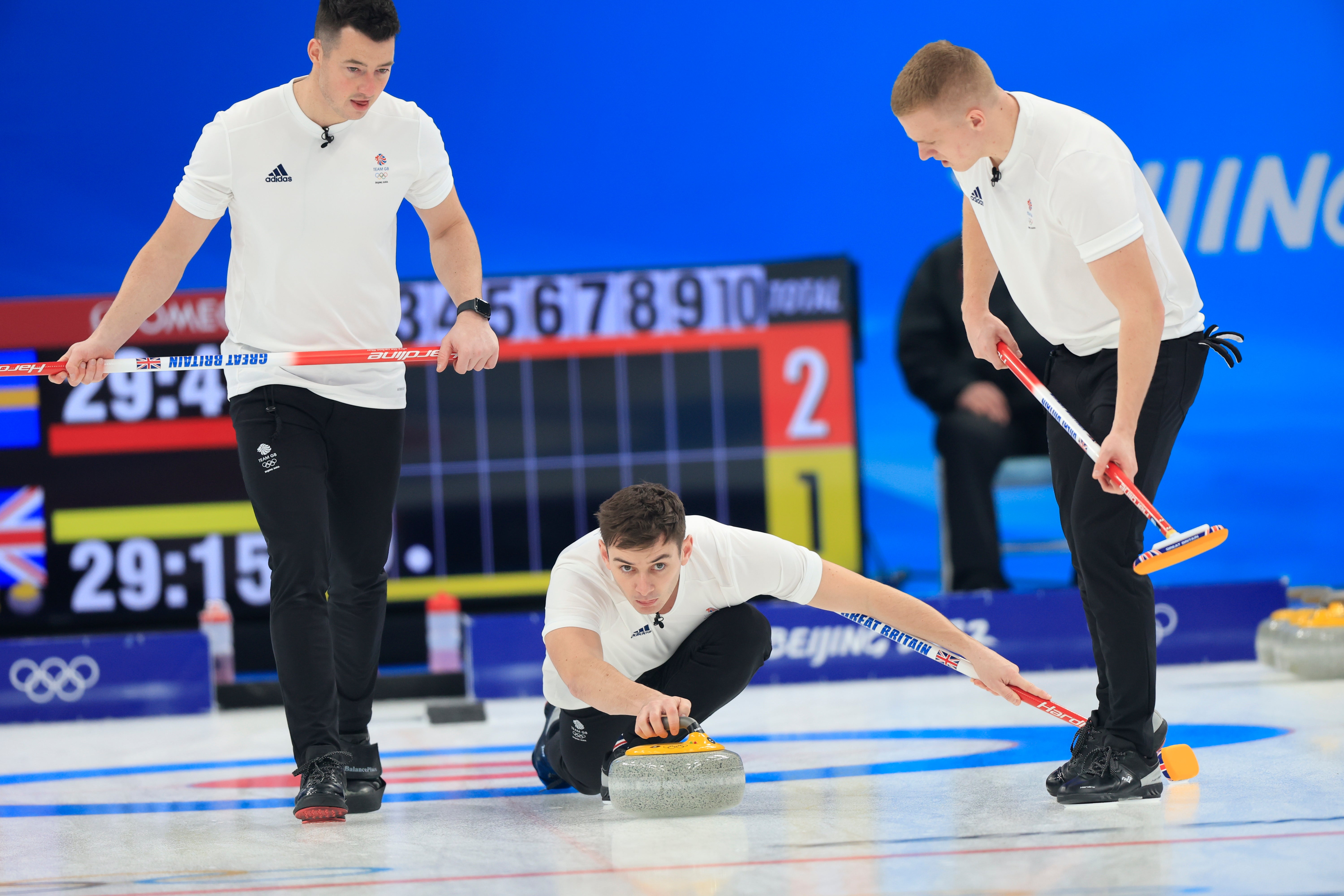 Grant Hardie sends a stone during the men’s curling final