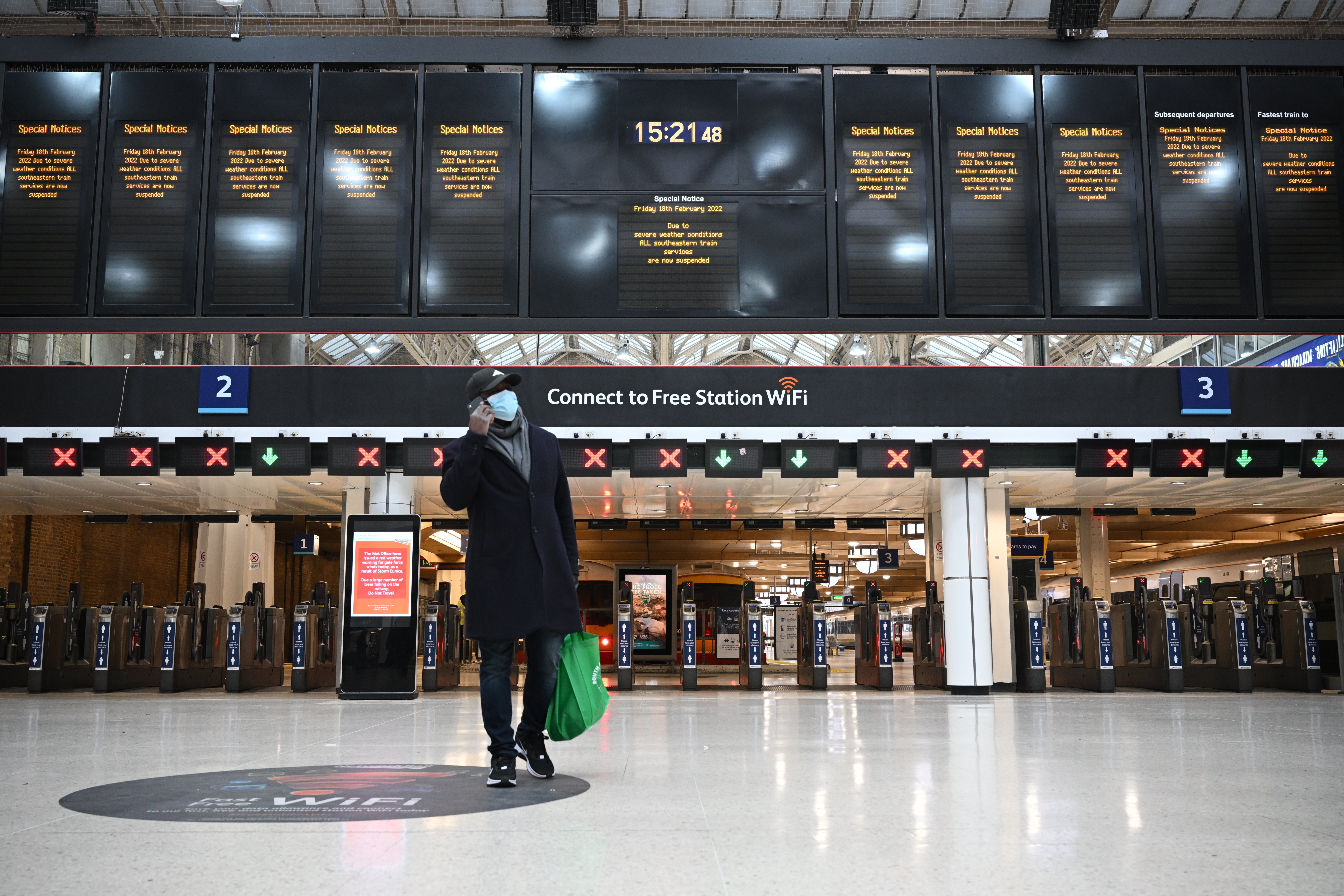 A special notice at Charing Cross station informs passengers that all Southeastern train services have been suspended due to the severe weather conditions