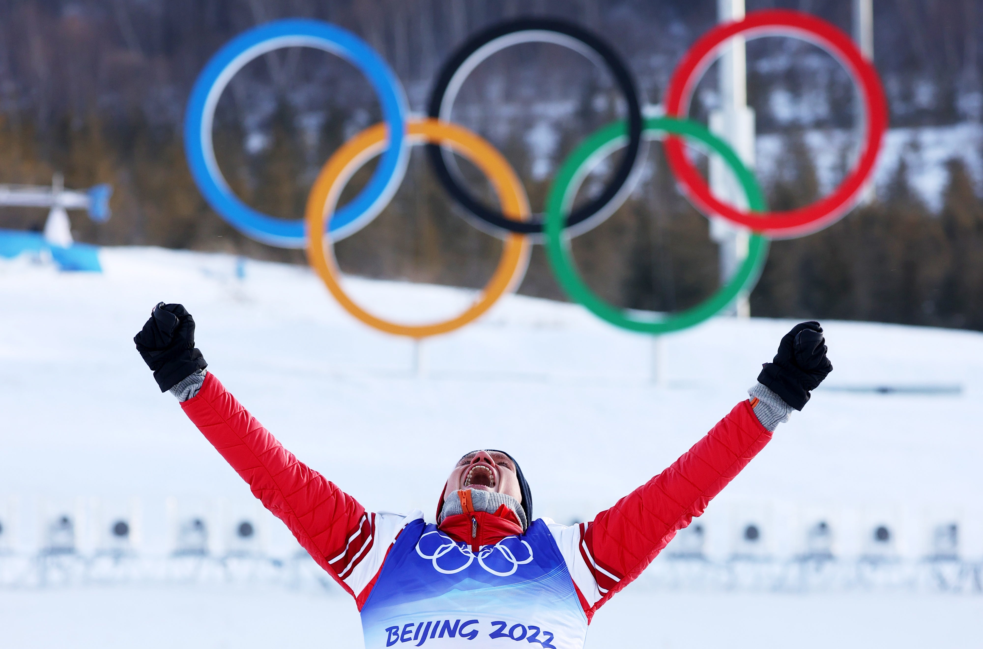 Alexander Bolshunov celebrates his gold medal