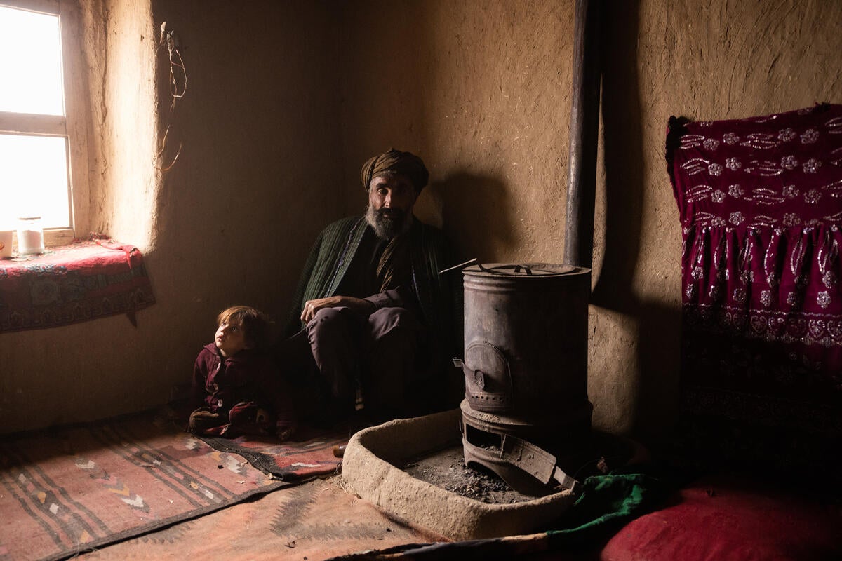 3-year-old Samira* and her grandfather. Samira was previously given treatment for malnutrition and pneumonia by Save the Children, and has fully recovered