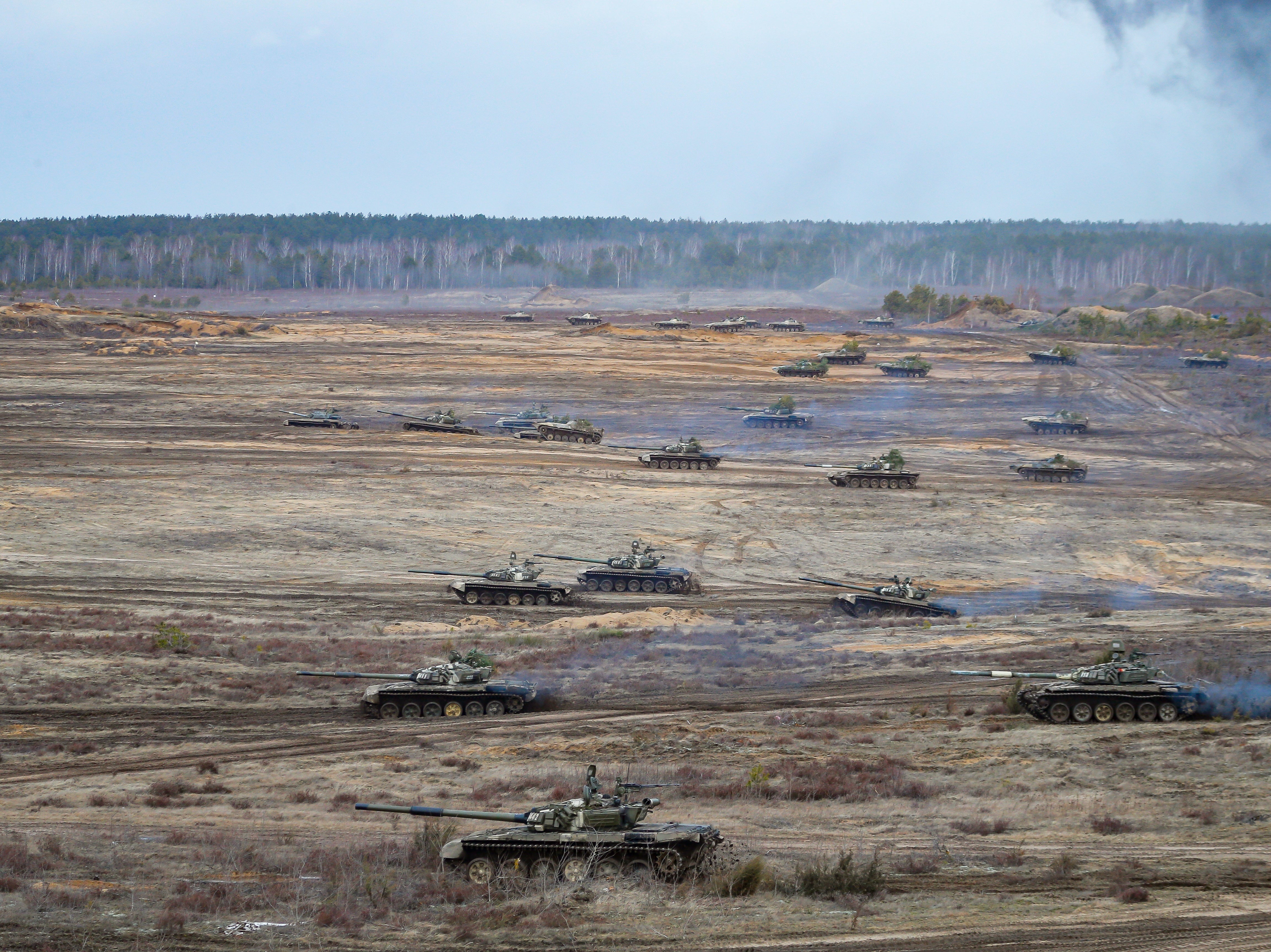 Tanks and armoured vehicles move during the Union Courage-2022 Russia-Belarus military drills at the Obuz-Lesnovsky training ground in Belarus, 19 February 2022