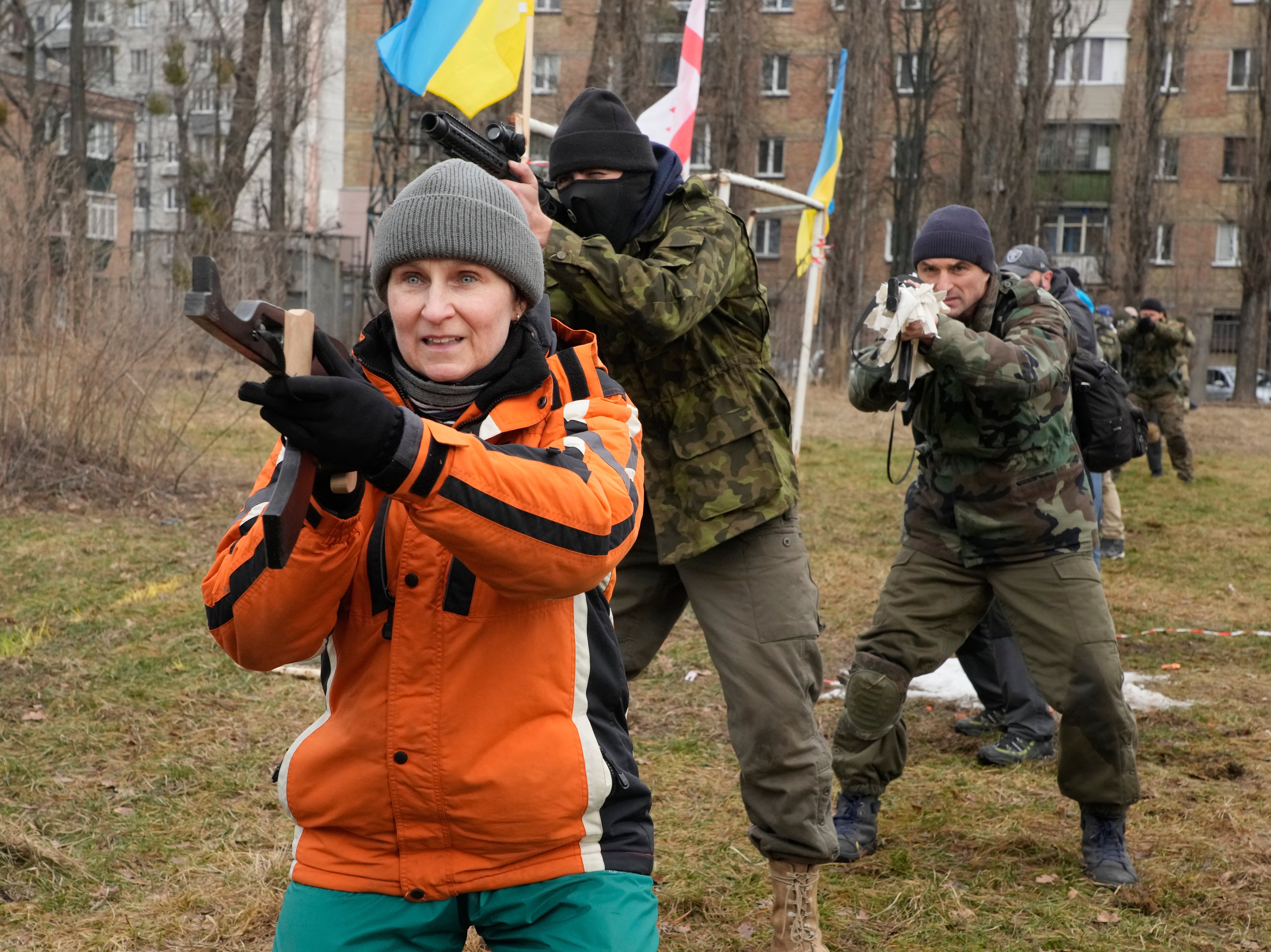 Civilians attend military training with members of the Georgian Legion, a paramilitary unit formed mainly by ethnic Georgian volunteers to fight against the Russian aggression in Ukraine in 2014, in Kyiv, Ukraine, 19 February 2022