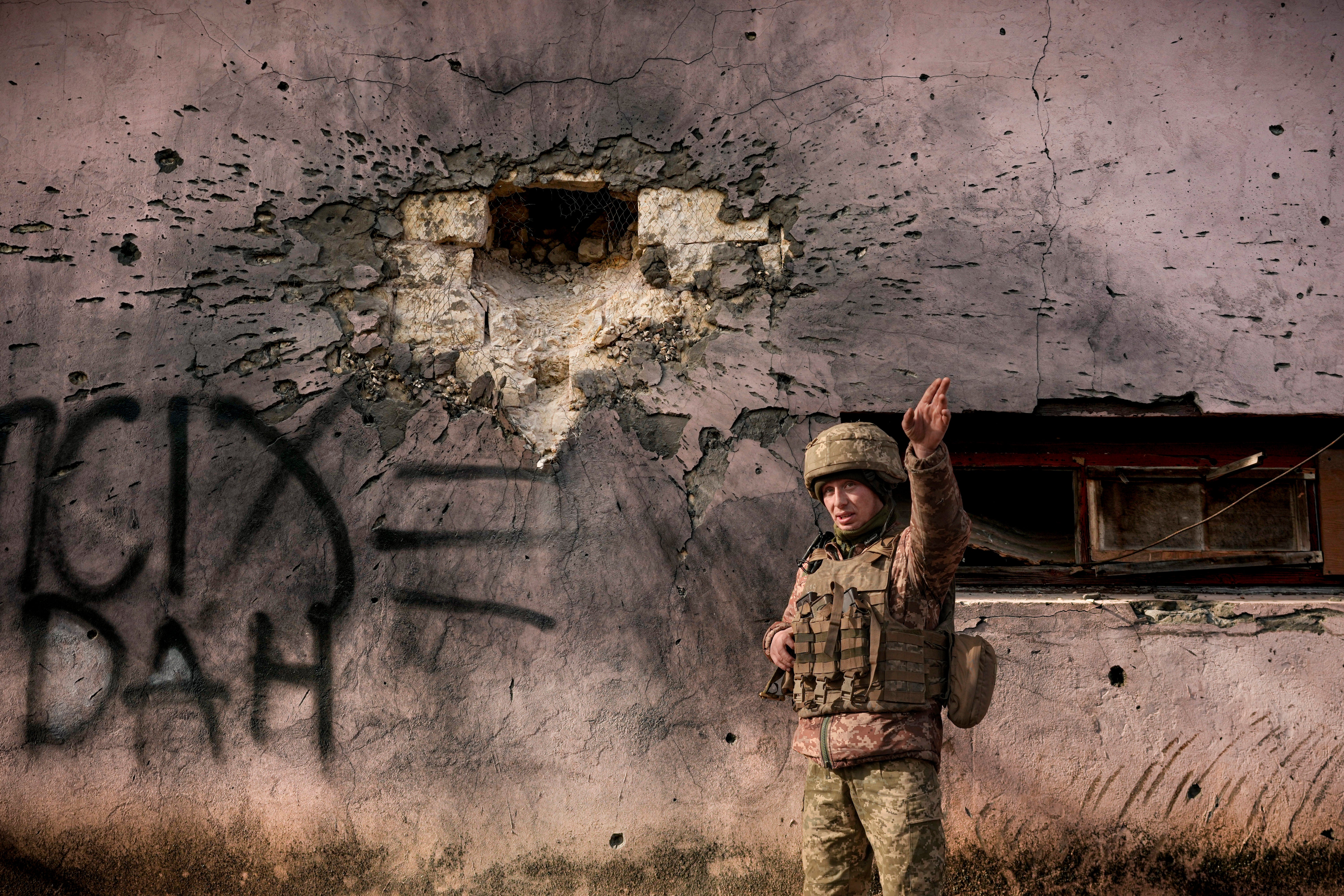 Two Ukrainian soldiers have died as violence in eastern Ukraine escalated on Saturday amid fears of an invasion by Russia (Vadim Ghirda/AP)