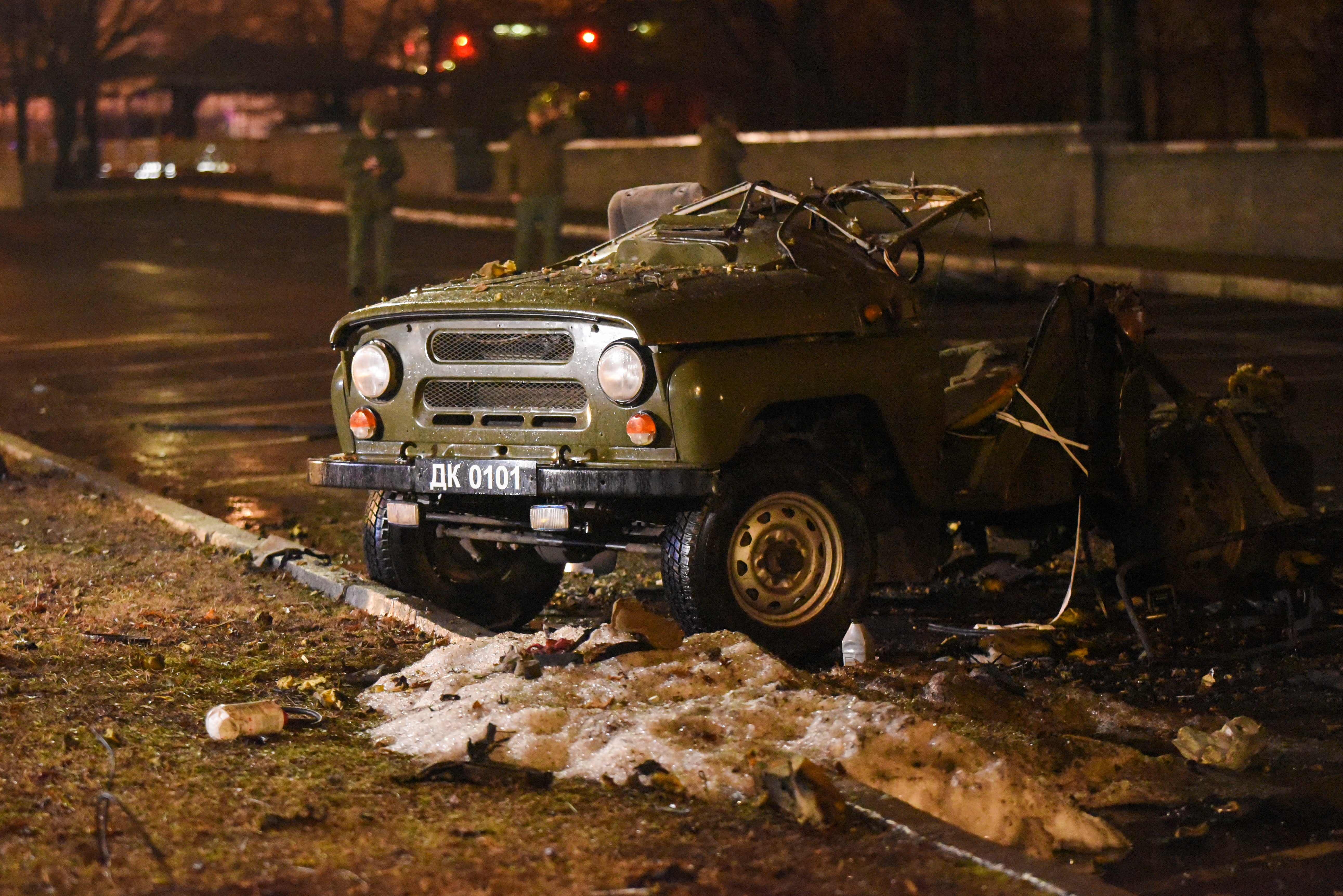 A car blown up on a parking lot outside a government building in central Donetsk