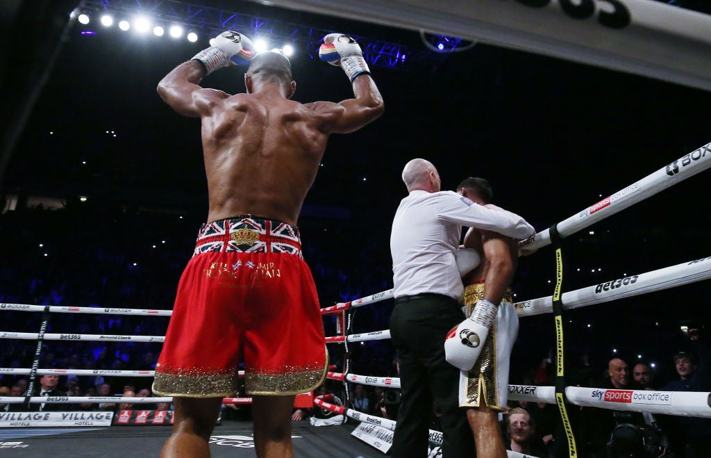 Referee Victor Loughlin stops the contest in the sixth round, leaving Brook jubilant