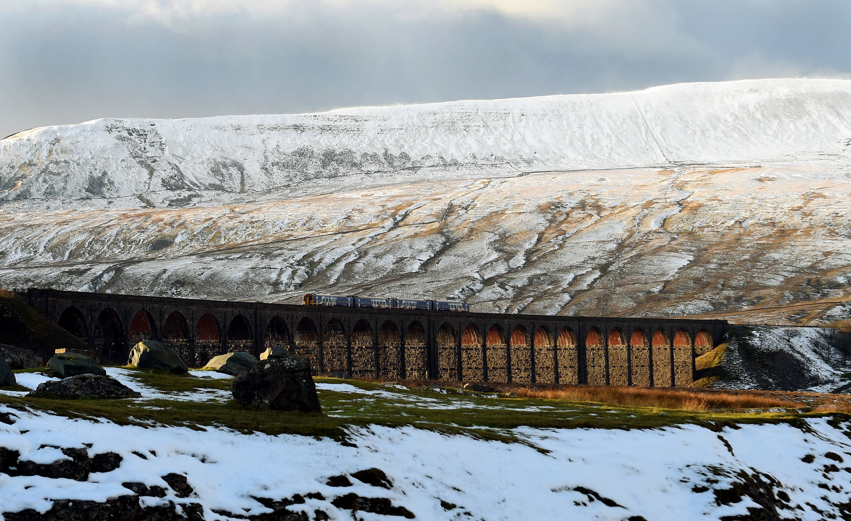 A TransPennine train crosses the Ribblehead Viaduct (Owen Humphreys/PA)