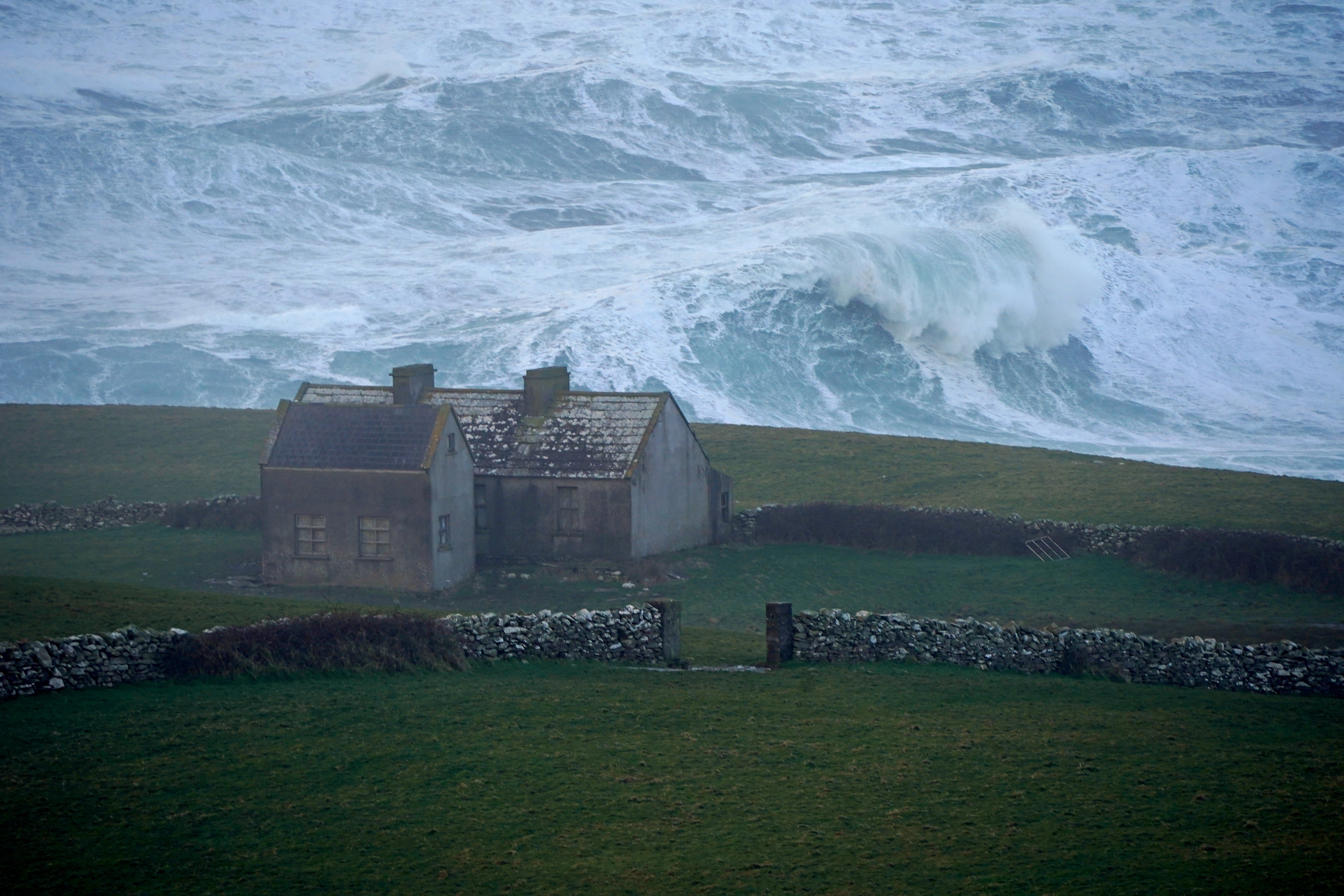 Waves crashing against the shore at Doolin in County Clare on the west coast of Ireland (Niall Carson/PA)