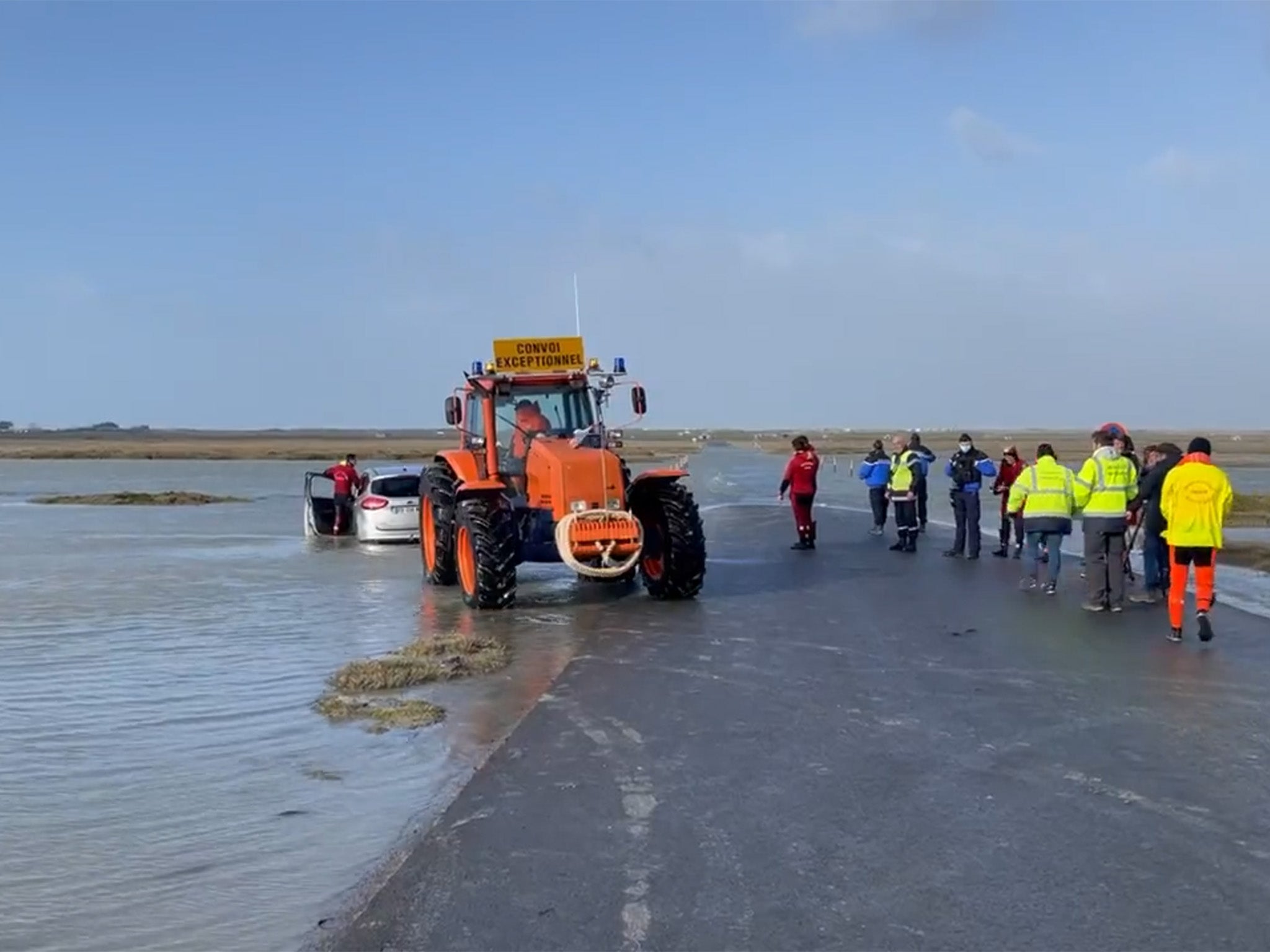 Couple’s car is dragged from the water on morning after