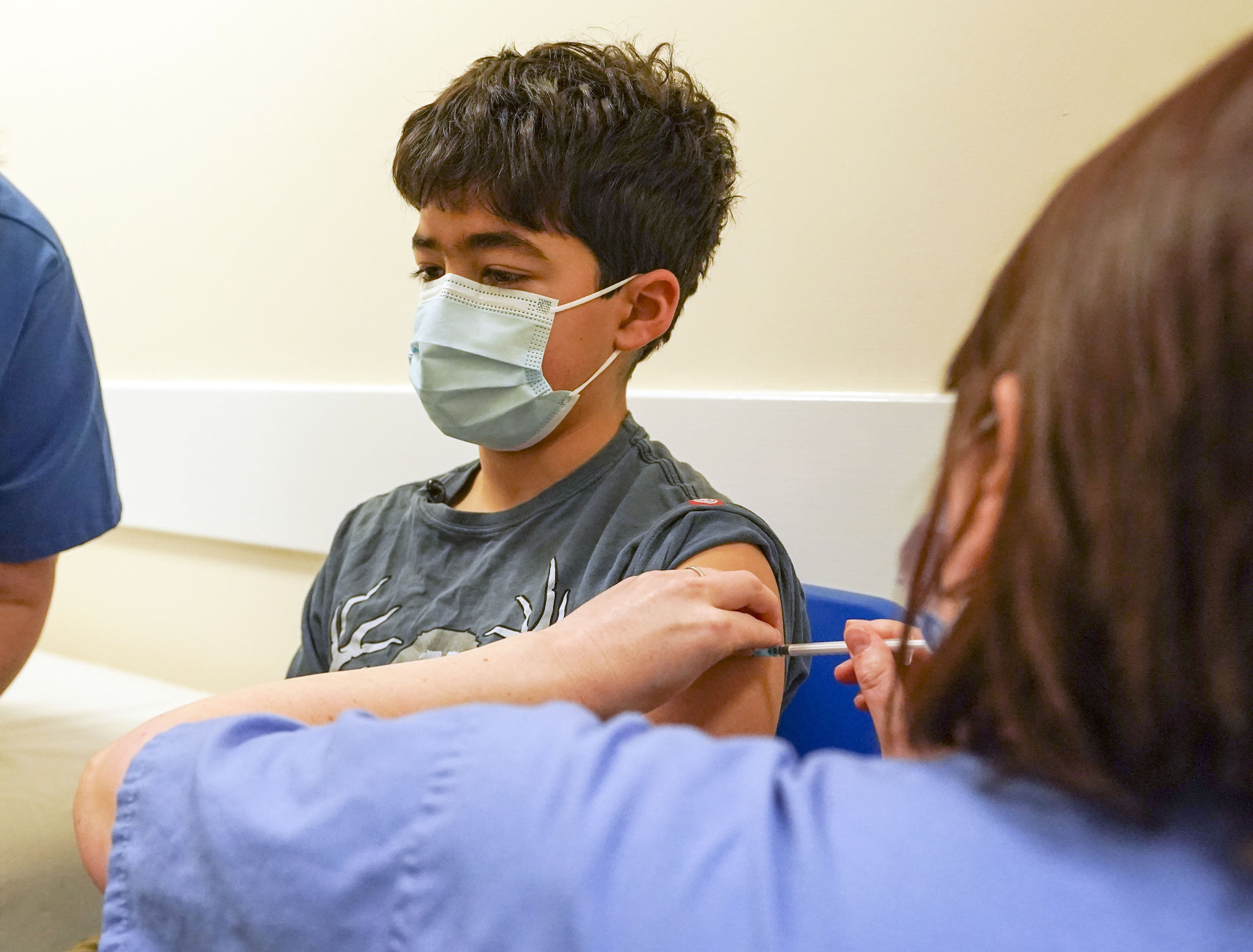 Xavier Aquilina, aged 11, has a Covid-19 vaccination at the Emberbrook Community Centre for Health in Thames Ditton, Surrey (Steve Parsons/PA)