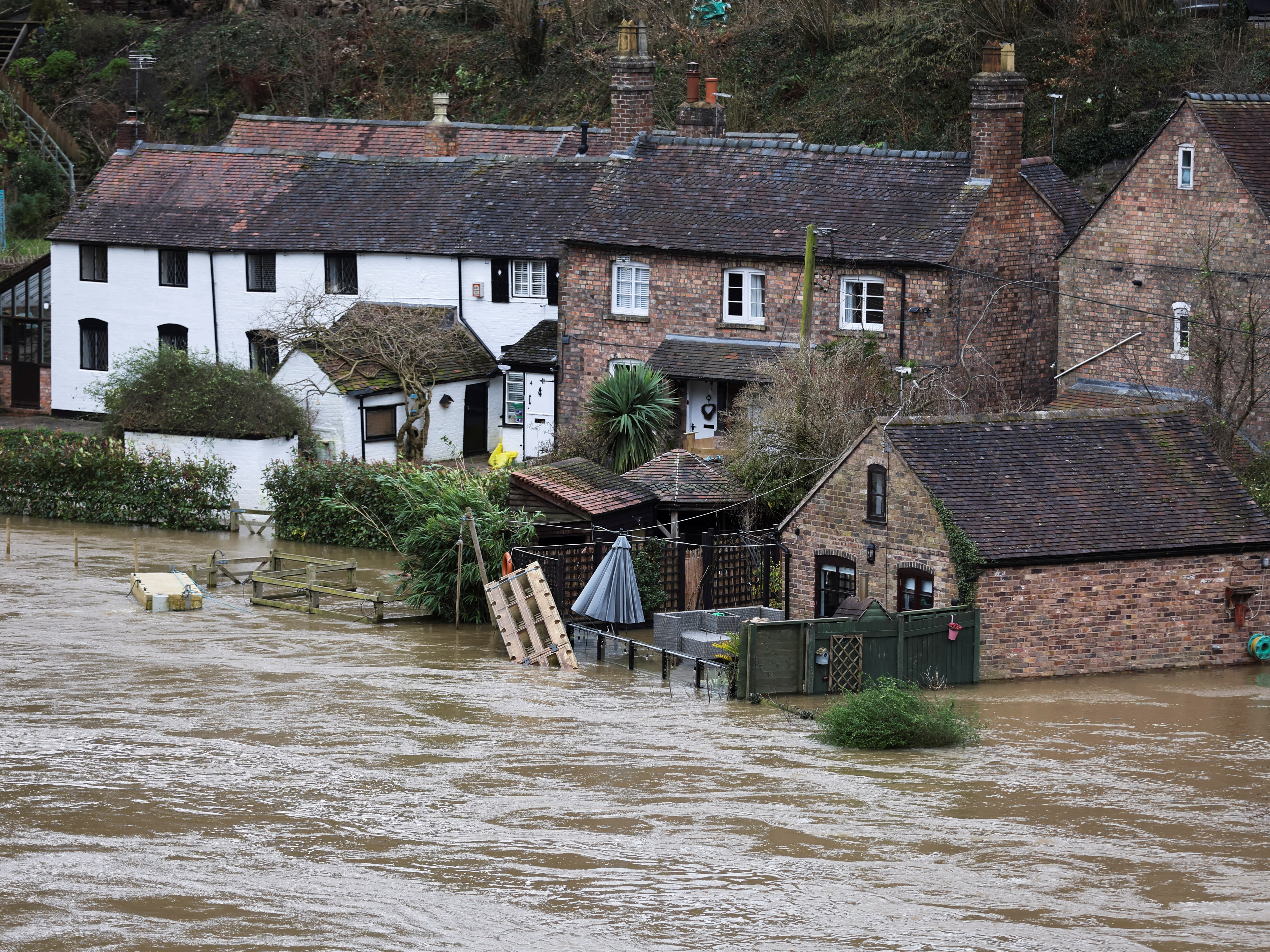 Houses are flooded after high water levels caused by Storm Franklin