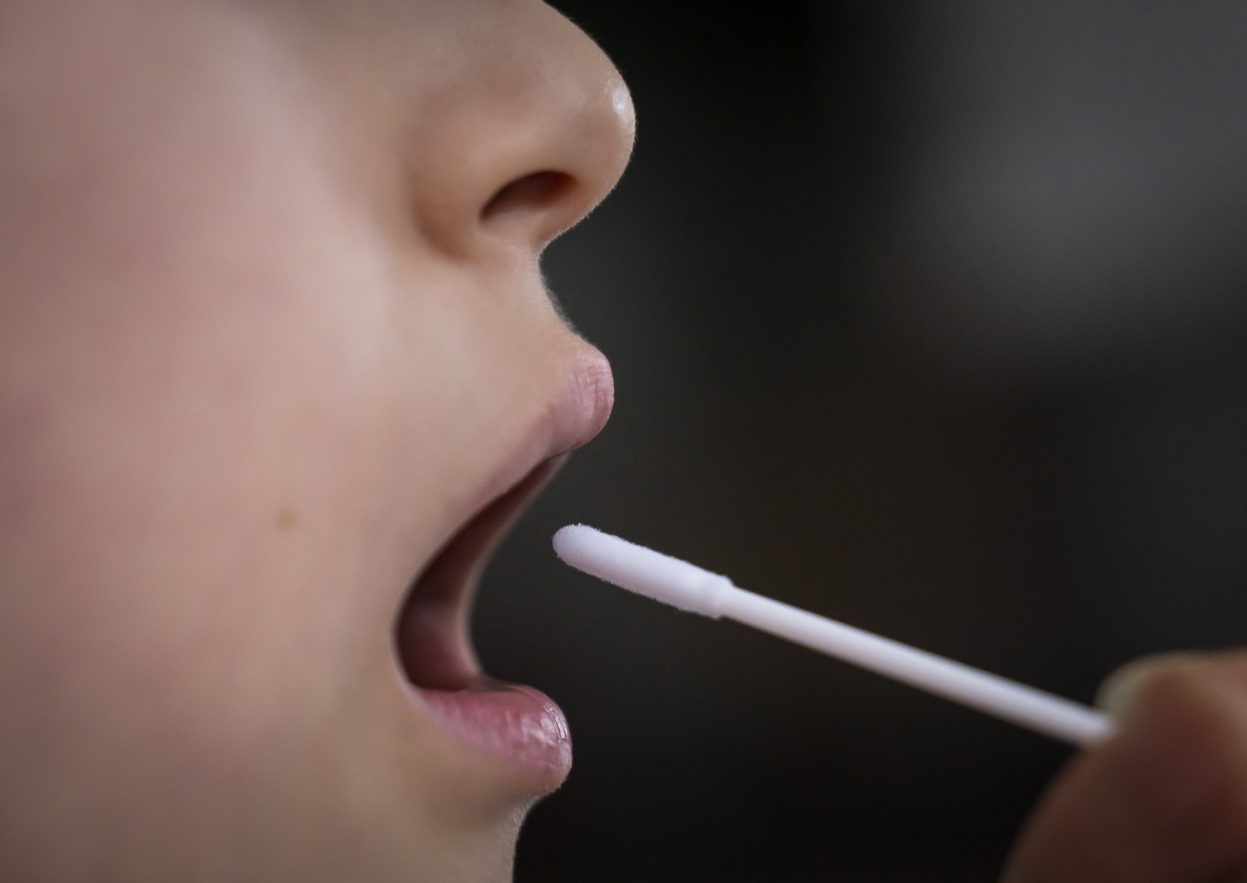 A person taking a Covid-19 test (Danny Lawson/PA)